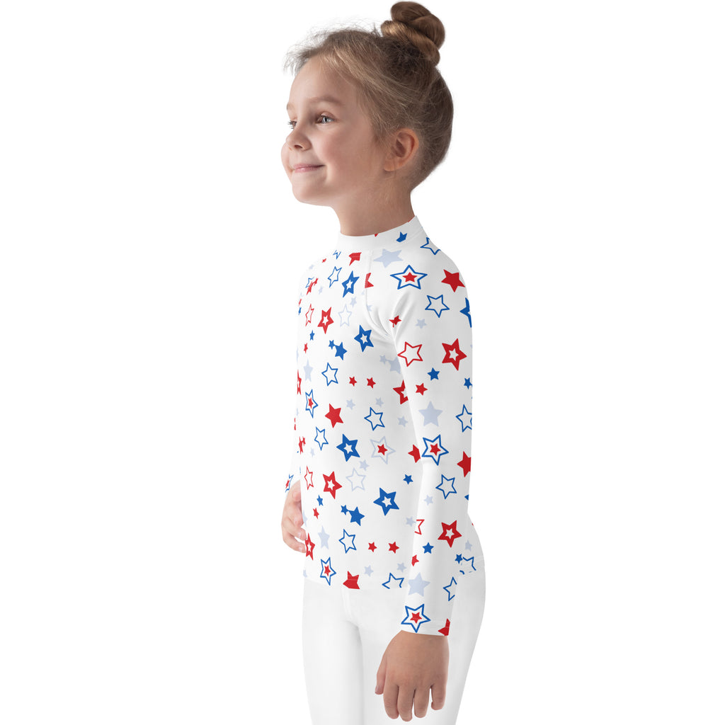 A child wearing a kids red white and blue stars usa long sleeve rash guard swim shirt with upf 50 plus