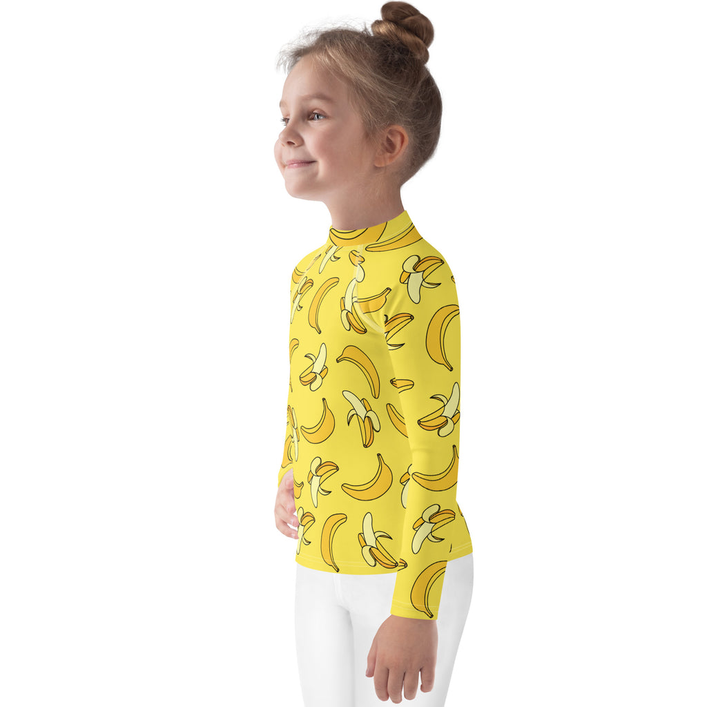 Yellow kids banana long sleeve rash guard swim shirt with playful banana pattern and UPF 50 plus protection