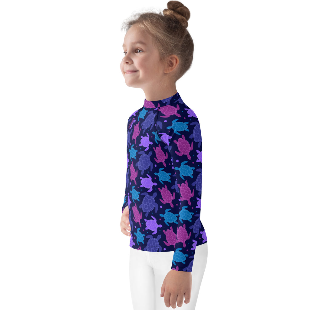 Girls purple sea turtle long sleeve navy blue rash guard swim shirt with playful pink purple teal turtles and upf 50+ protection