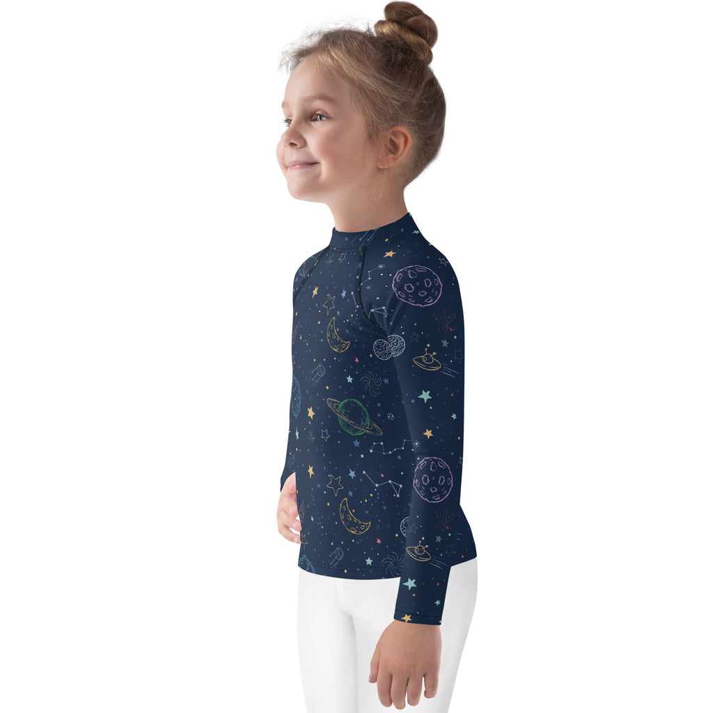 Kids galaxy long sleeve rash guard swim shirt in navy blue with playful pastel space print and UPF 50+ protection