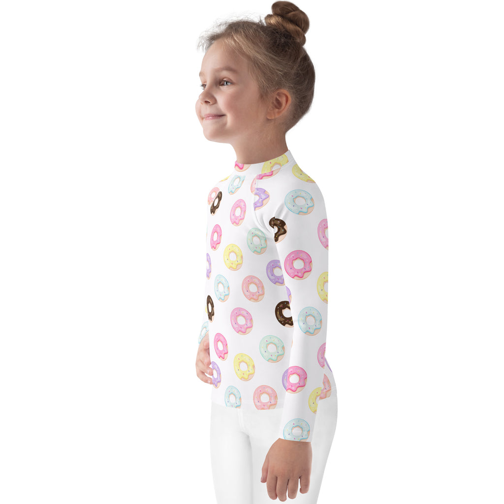 Kids colorful donuts long sleeve rash guard swim shirt with upf 50 white with pastel pink yellow blue and brown donut pattern