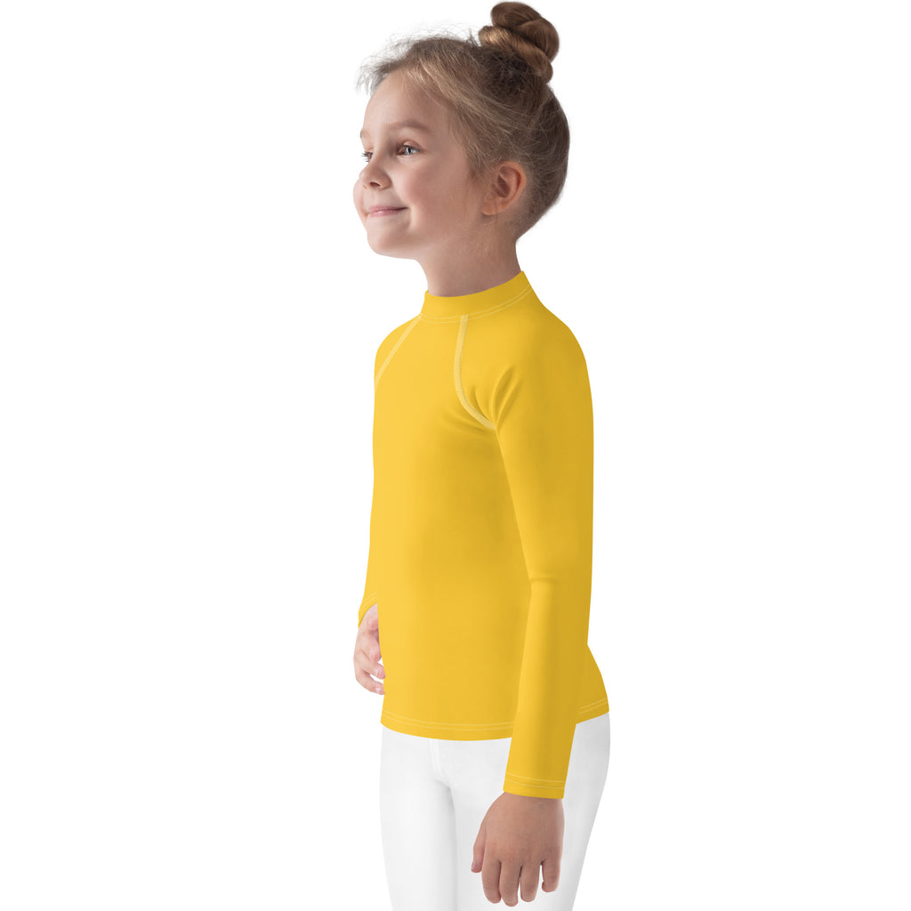 Kids yellow long sleeve rash guard swim shirt with UPF 50 plus made from stretchy performance fabric with high collar