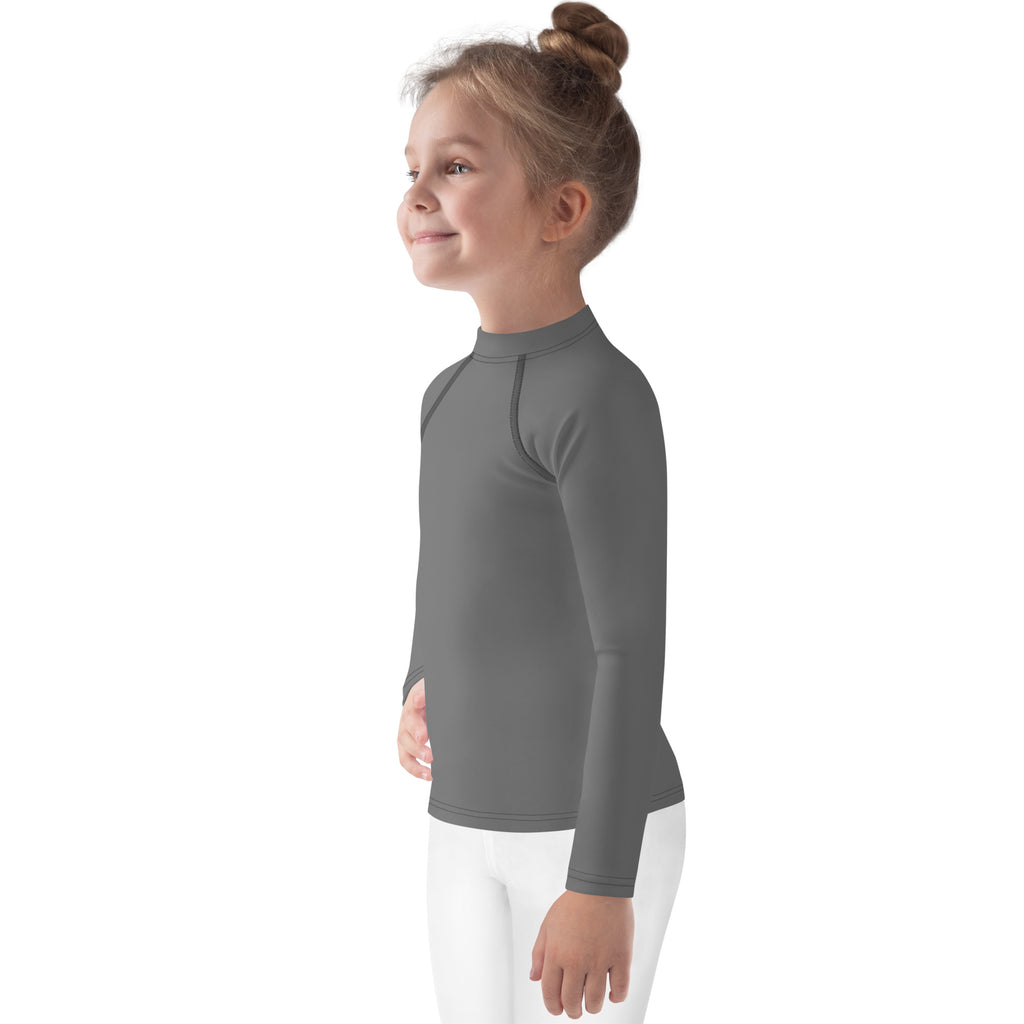 A child wearing a kids gray long sleeve rash guard swim shirt with UPF 50 plus and seamless construction
