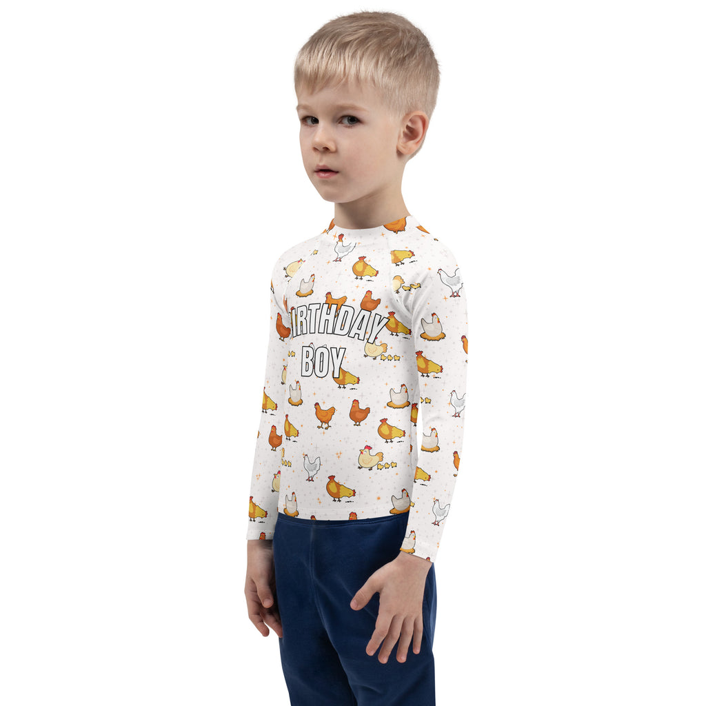 White long sleeve rash guard swim shirt with playful yellow orange cartoon chickens and birthday boy text with upf 50+