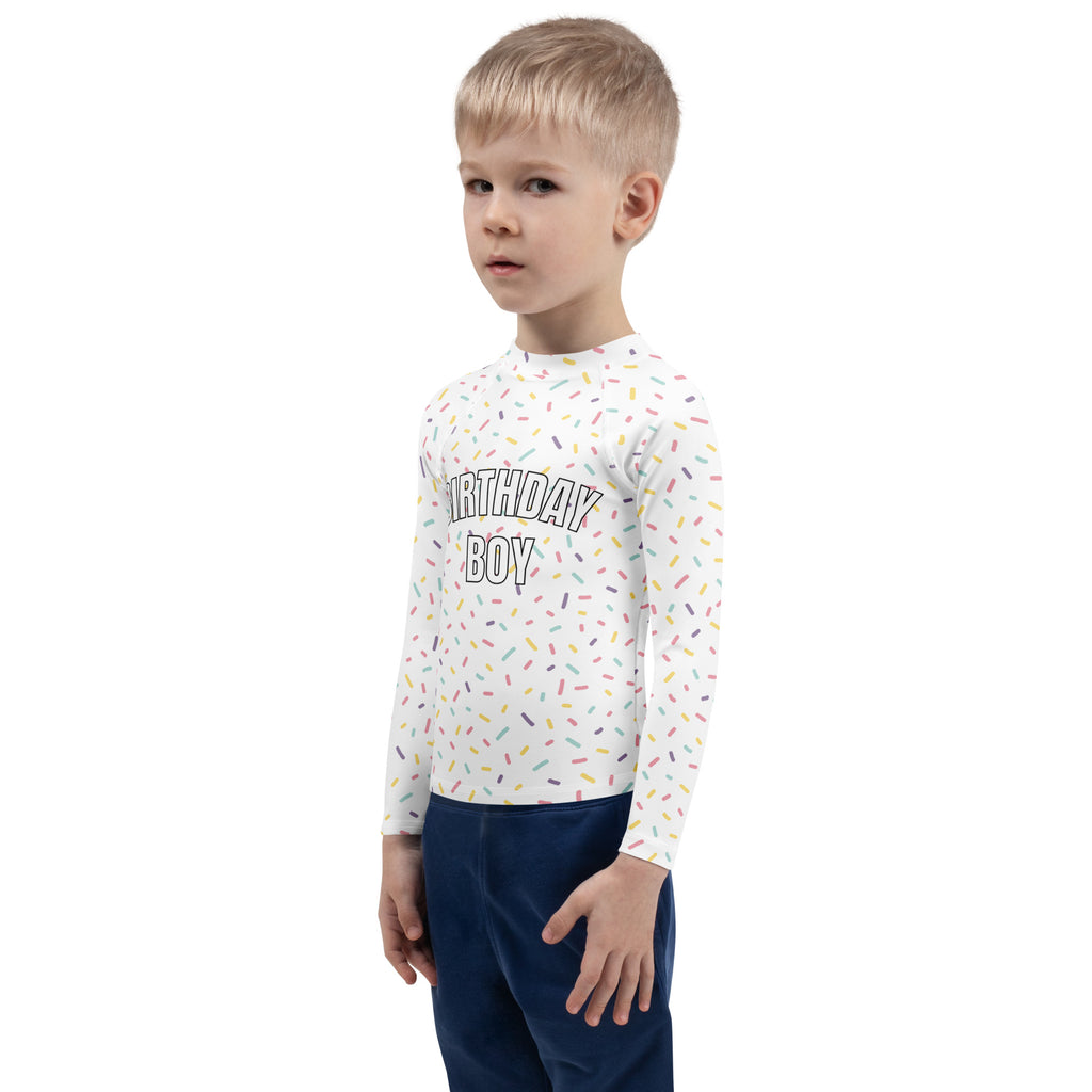 White long sleeve rash guard swim shirt with birthday boy text colorful sprinkle pattern and upf 50 plus protection