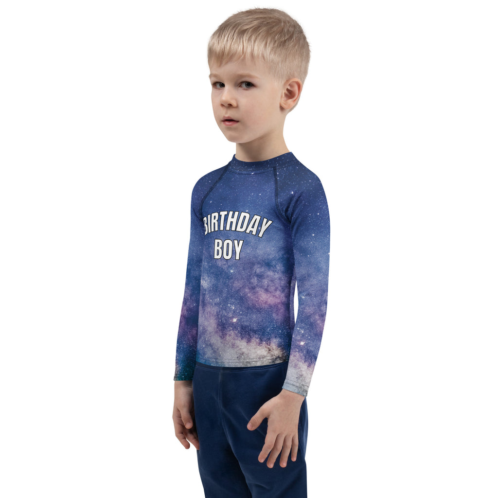 Blue long sleeve rash guard with galaxy print and birthday boy text made for sun protection swim shirt upf 50+