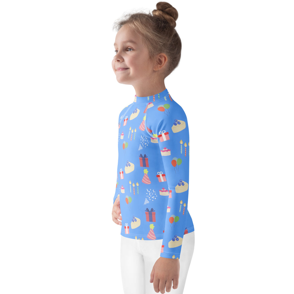 Kids blue long sleeve rash guard swim shirt with birthday cake pattern and UPF 50 plus sun protection