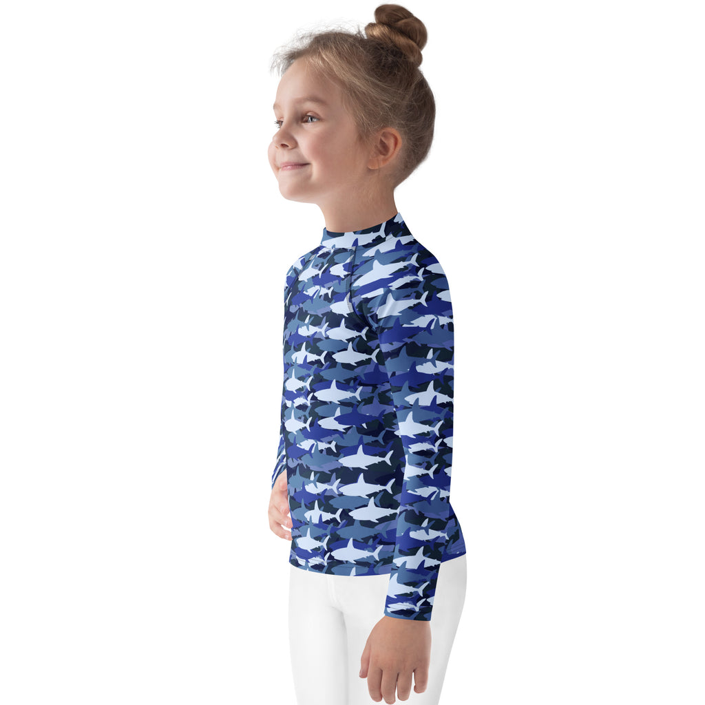 Kids blue and white shark-patterned long sleeve rash guard swim shirt with UPF 50 plus for sun protection