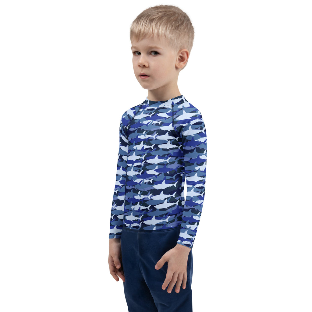 Kids blue and white shark-patterned long sleeve rash guard swim shirt with UPF 50 plus for sun protection