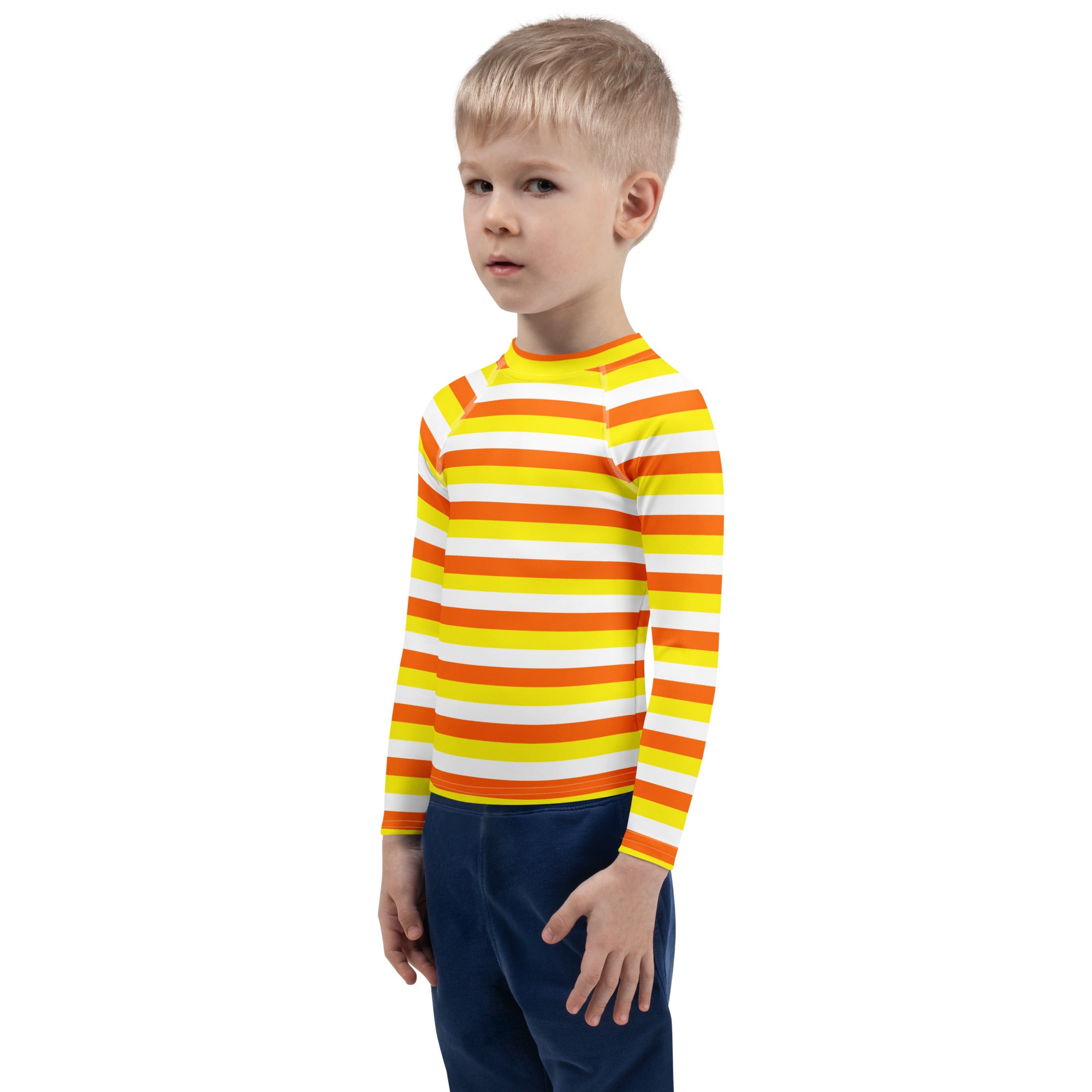 A child wearing a kids candy corn stripes halloween long sleeve rash guard swim shirt with upf 50 plus