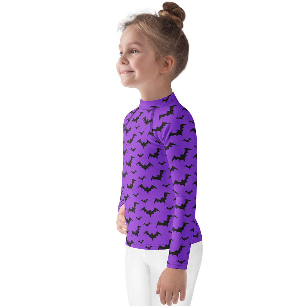 Kids purple long sleeve rash guard swim shirt with black bat prints and UPF 50 plus for Halloween protection