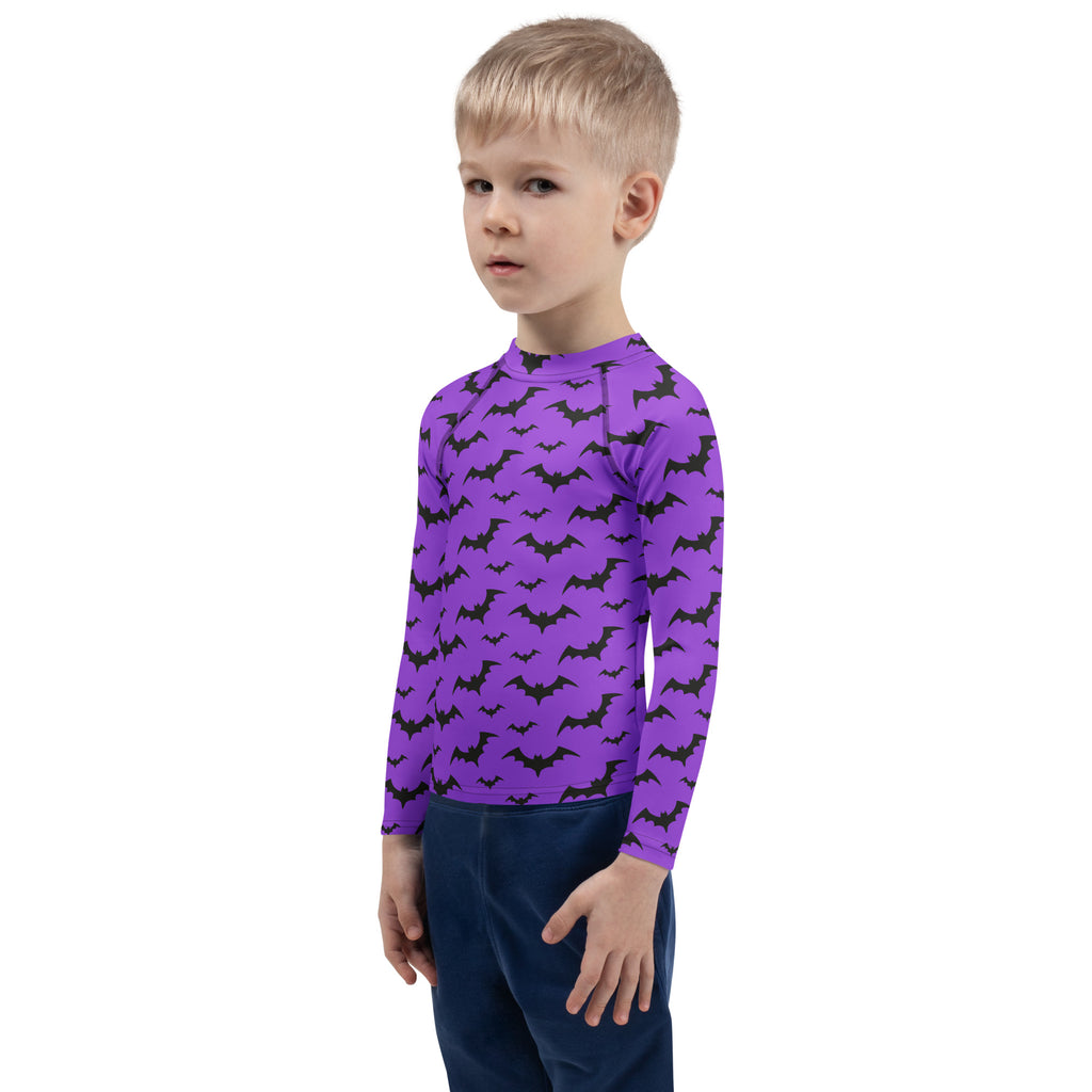 Kids purple long sleeve rash guard swim shirt with black bat patterns and UPF 50 plus sun protection for Halloween