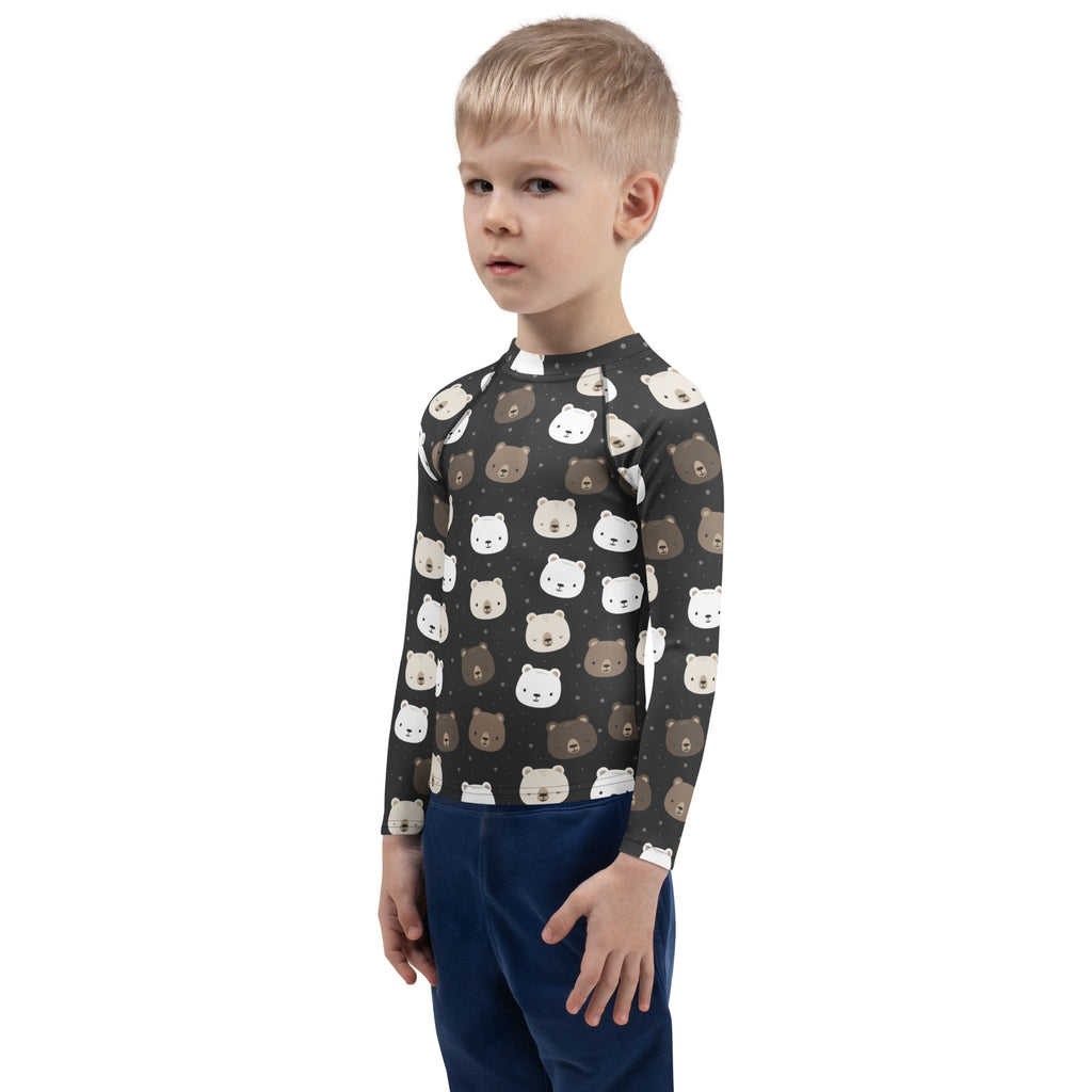 A child wearing a dark gray kids bear faces long sleeve rash guard swim shirt with UPF 50+ and white brown bear faces pattern
