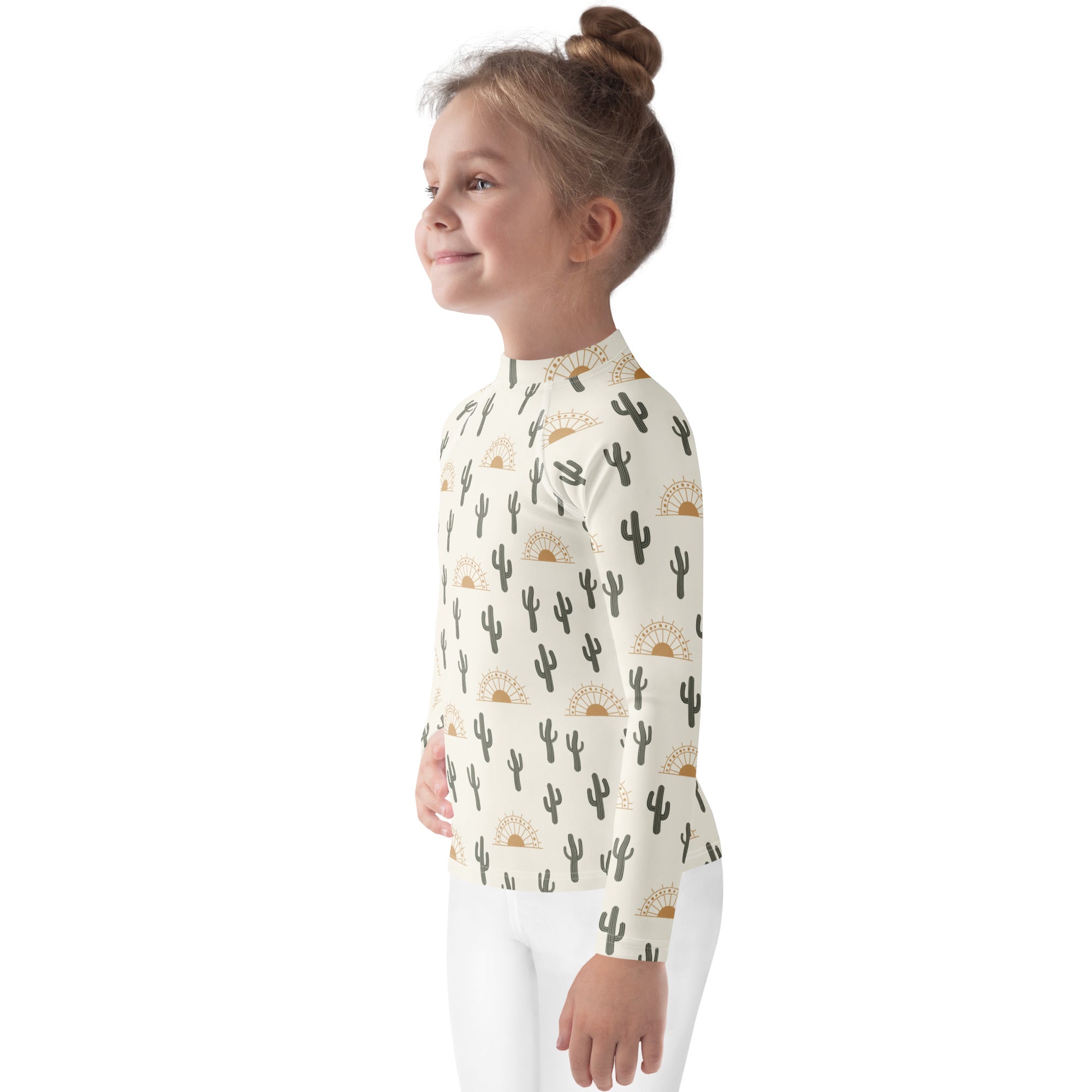 Kids cactus desert sunrise long sleeve rash guard swim shirt cream base with black cactus and gold sunburst patterns upf 50+