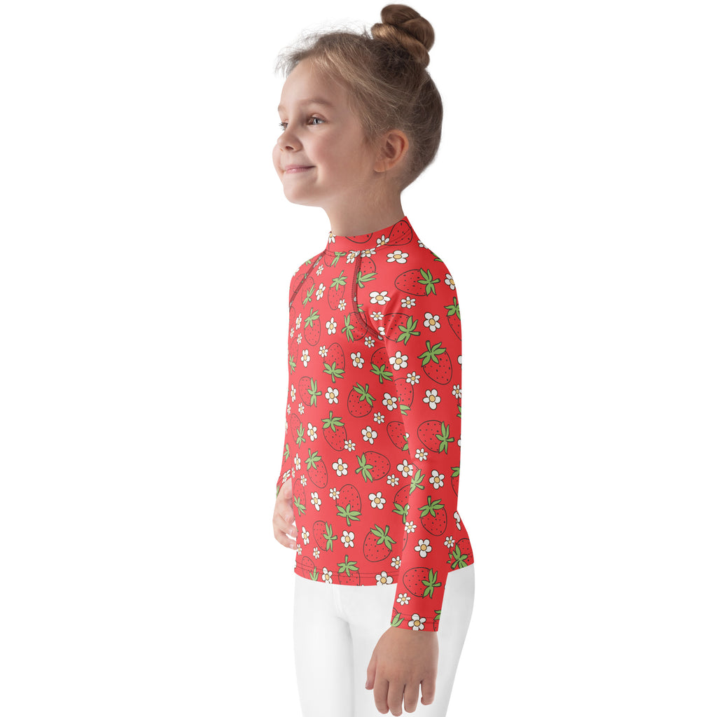 Kids red long sleeve rash guard swim shirt with playful strawberry and white flower pattern and UPF 50 plus protection