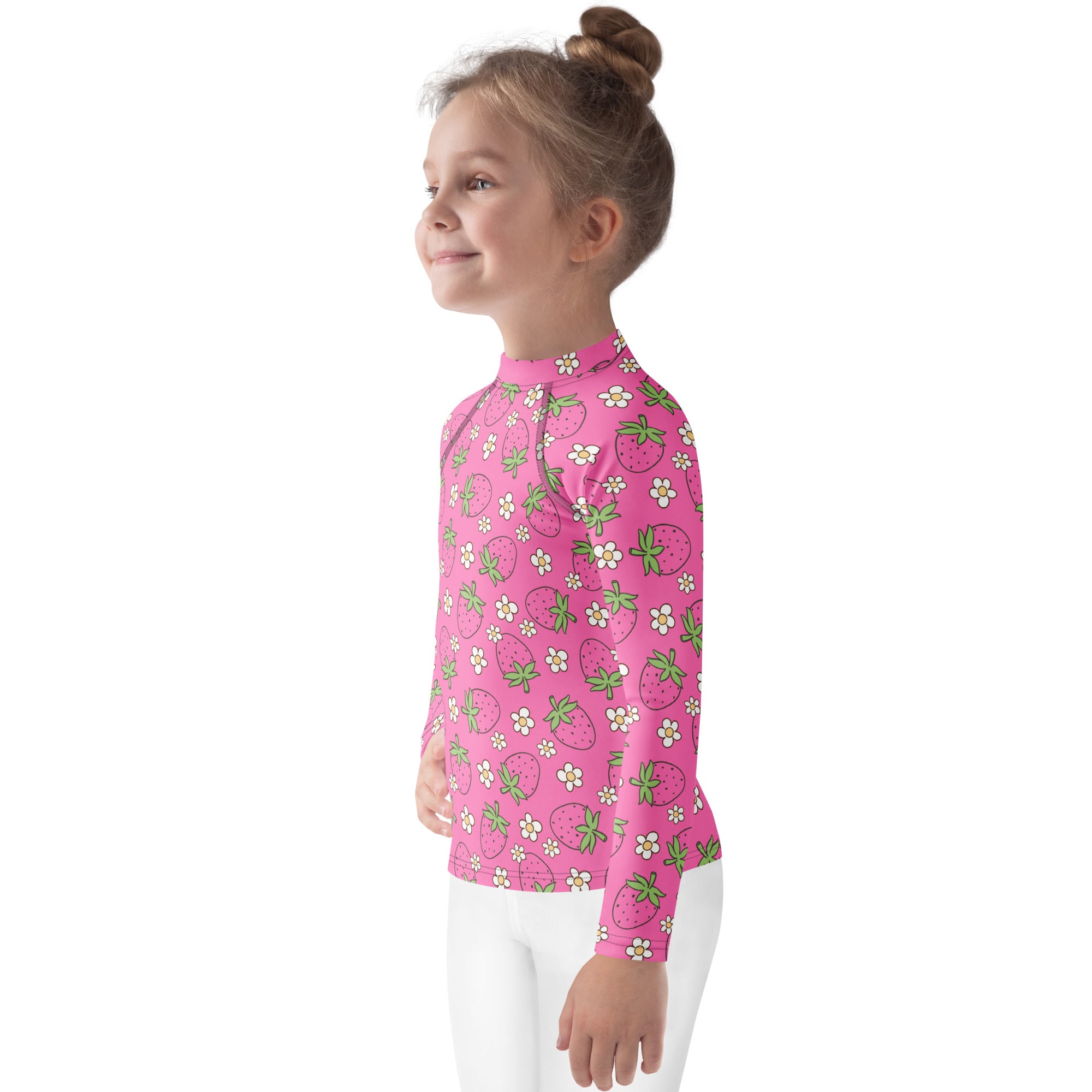 Girls pink long sleeve rash guard swim shirt with playful strawberry and white flower pattern and upf 50 plus protection