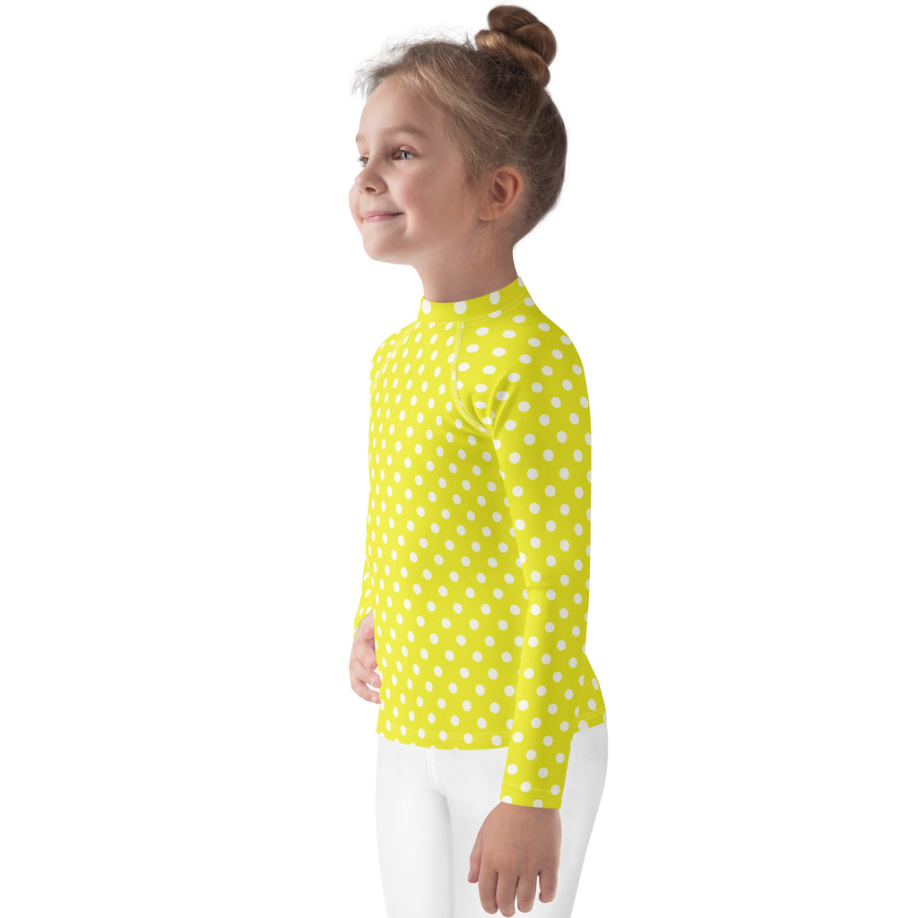 Kids yellow long sleeve rash guard swim shirt with white polka dots and upf 50 plus for sun protection