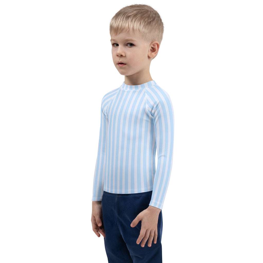 A child wearing a kids blue and white striped long sleeve rash guard swim shirt with UPF 50 plus protection