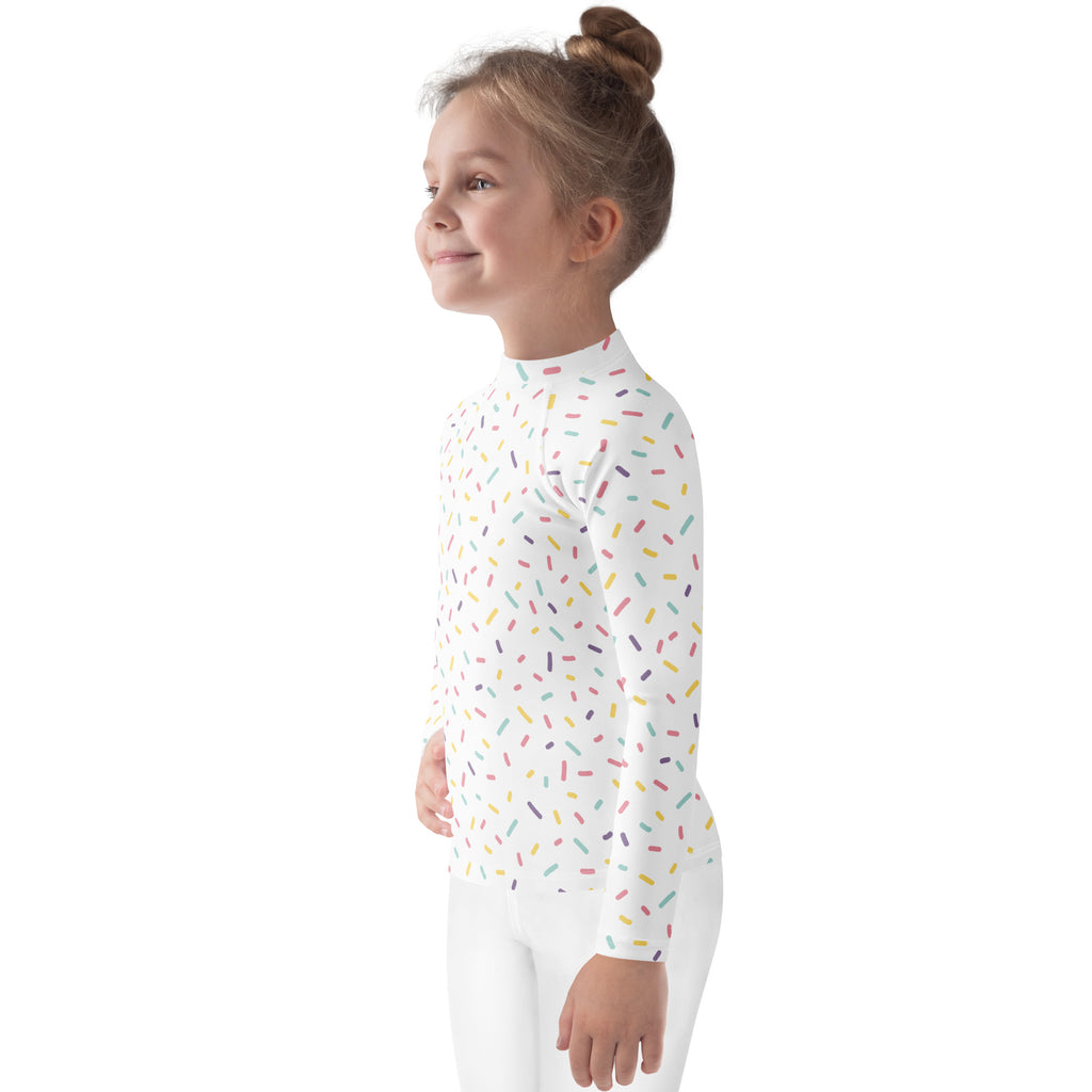 White kids long sleeve rash guard swim shirt with colorful sprinkles pattern and UPF 50 plus sun protection