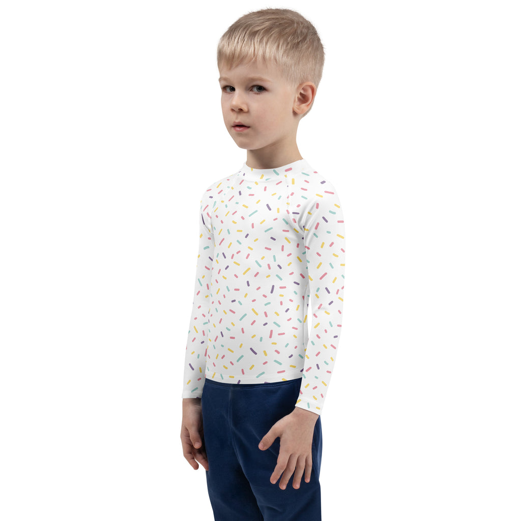 White long-sleeved rash guard swim shirt for kids with colorful sprinkles pattern and upf 50 plus protection