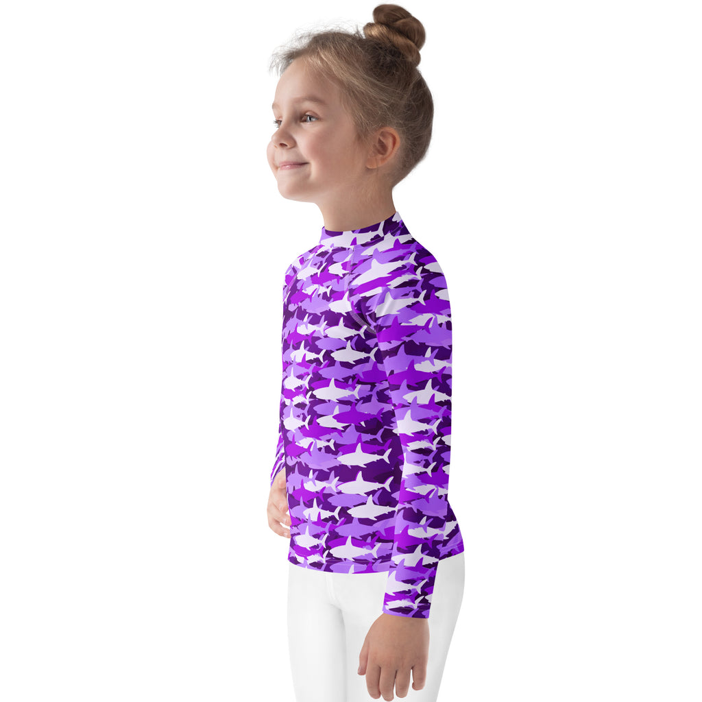 Girls purple and white shark-patterned long sleeve rash guard swim shirt with UPF 50 plus for sun protection
