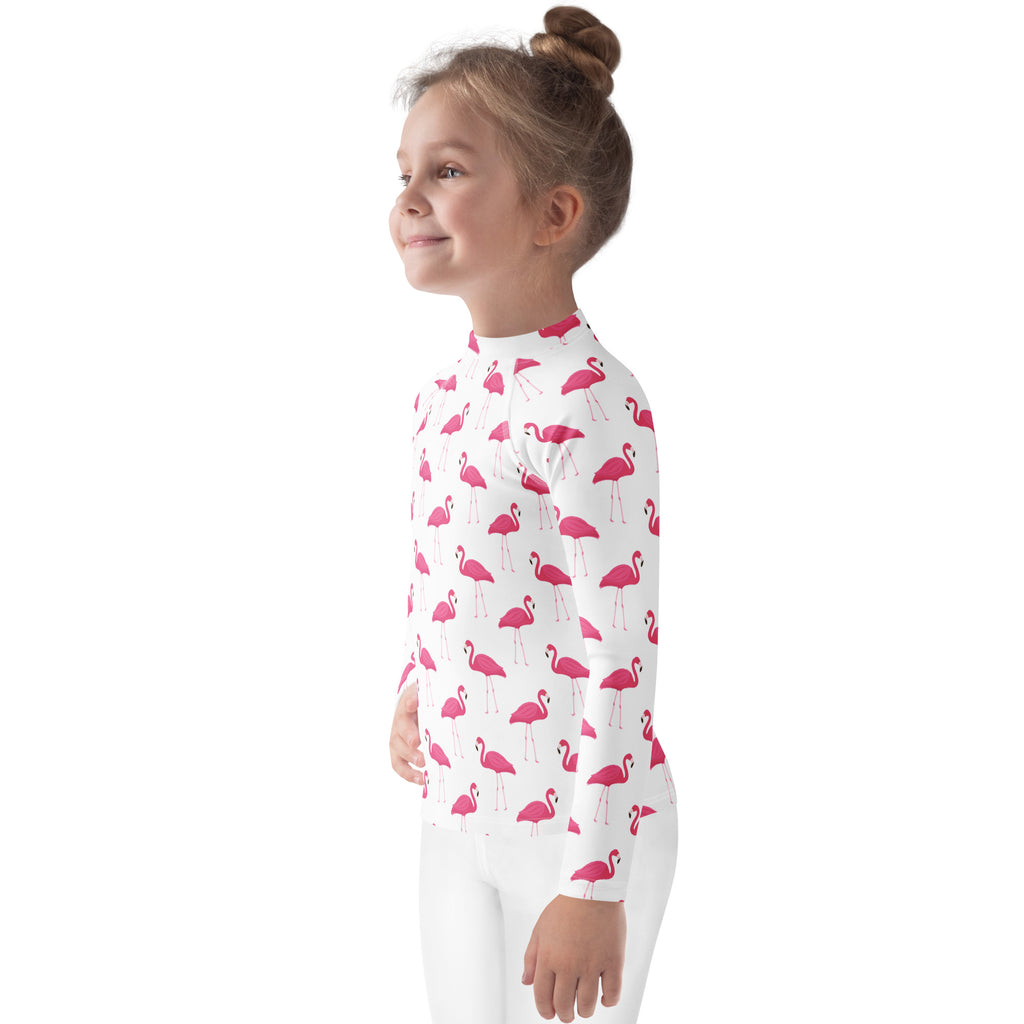 White long-sleeved kids rash guard swim shirt with pink flamingo pattern and upf 50 plus sun protection