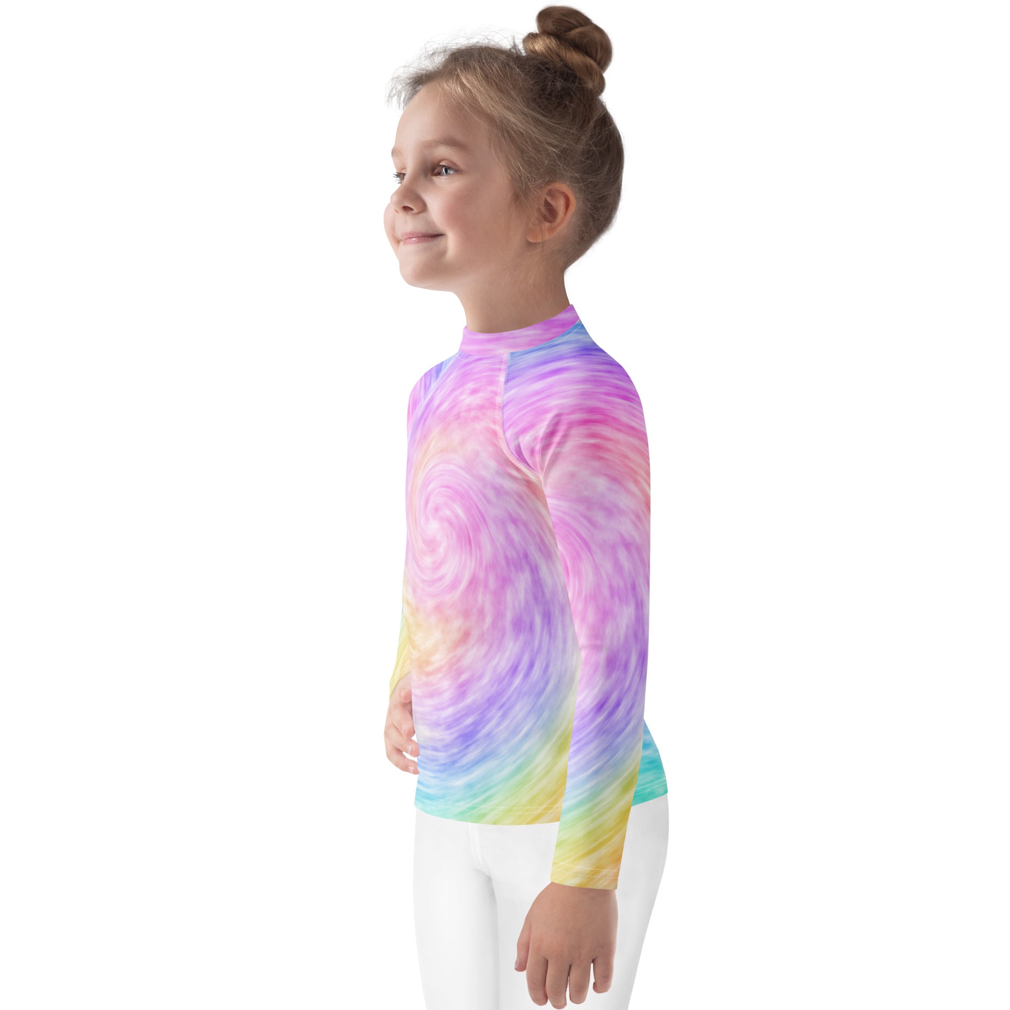 A child wearing a kids rainbow tie dye long sleeve rash guard swim shirt with vibrant pastel swirl pattern and UPF 50+ protection