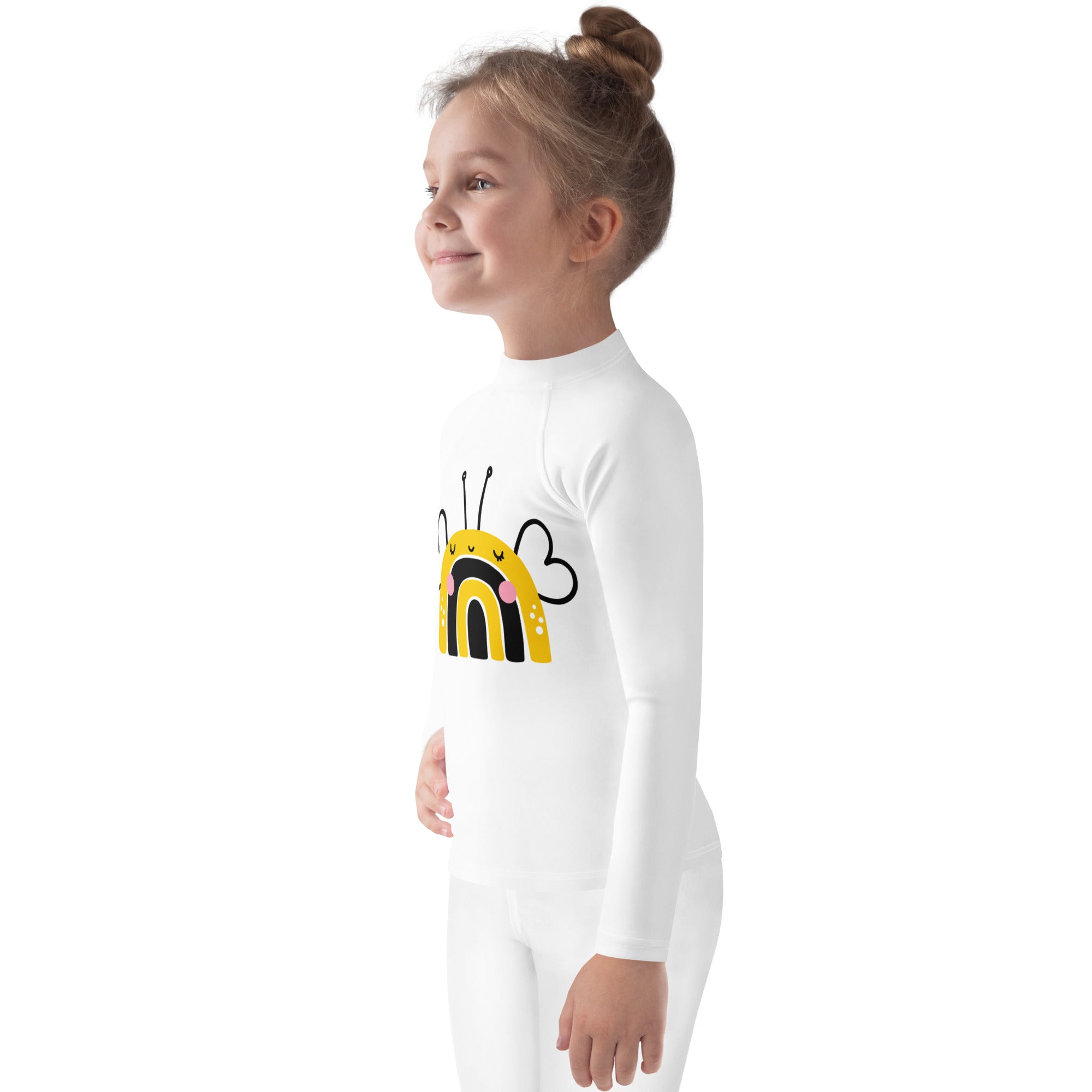 White kids long sleeve rash guard swim shirt with upf 50+ featuring playful yellow and black bee design with pink cheeks and rainbows