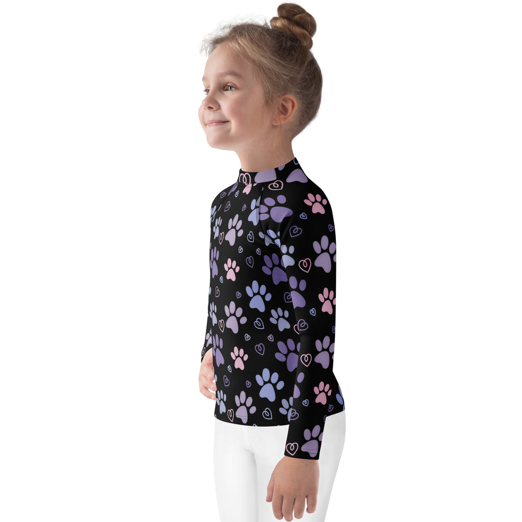 Girls purple and pink paw print long sleeve rash guard swim shirt with upf 50 plus in black with playful pattern