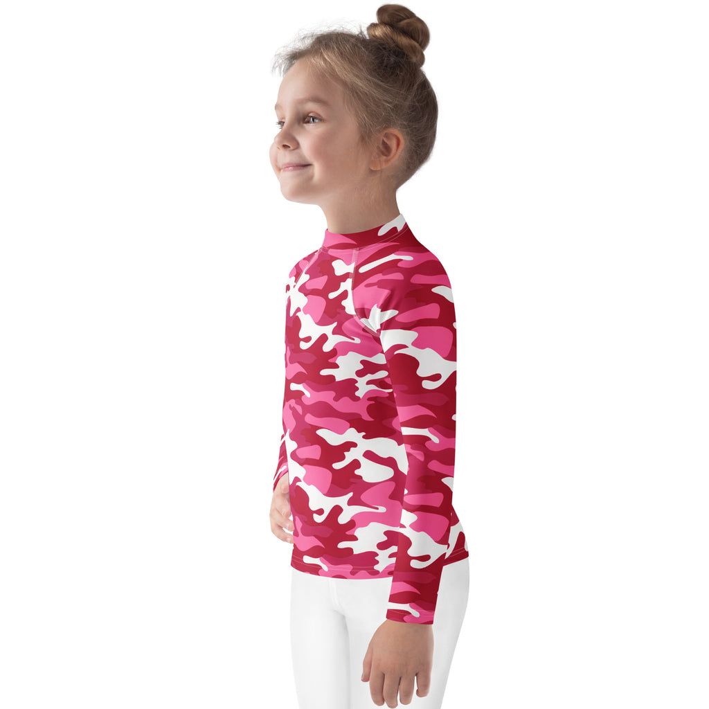 A vibrant pink and white camouflage long sleeve rash guard swim shirt for girls with UPF 50 plus sun protection