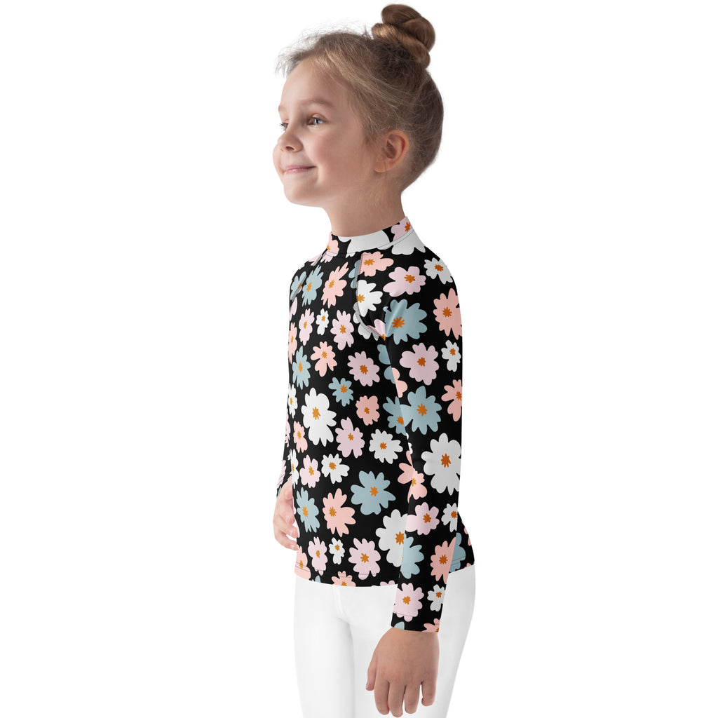 Girls flower scale long sleeve rash guard swim shirt in black with pastel pink white and light blue daisy pattern upf 50+