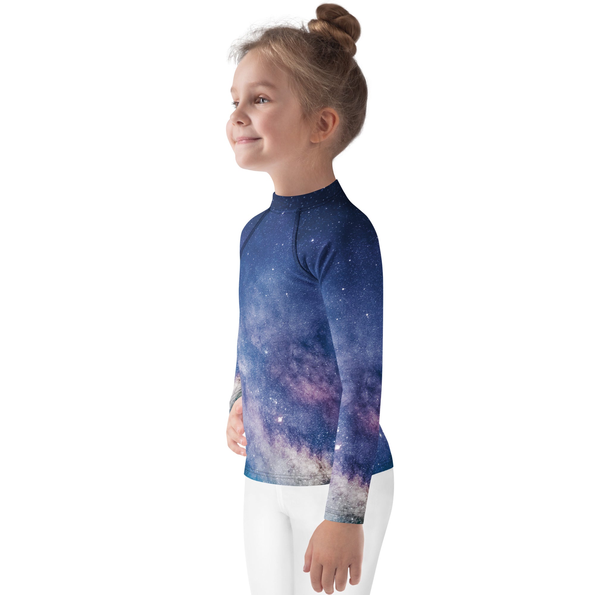 A child wearing a kids realistic galaxy long sleeve rash guard swim shirt with upf 50 plus in deep blue and purple