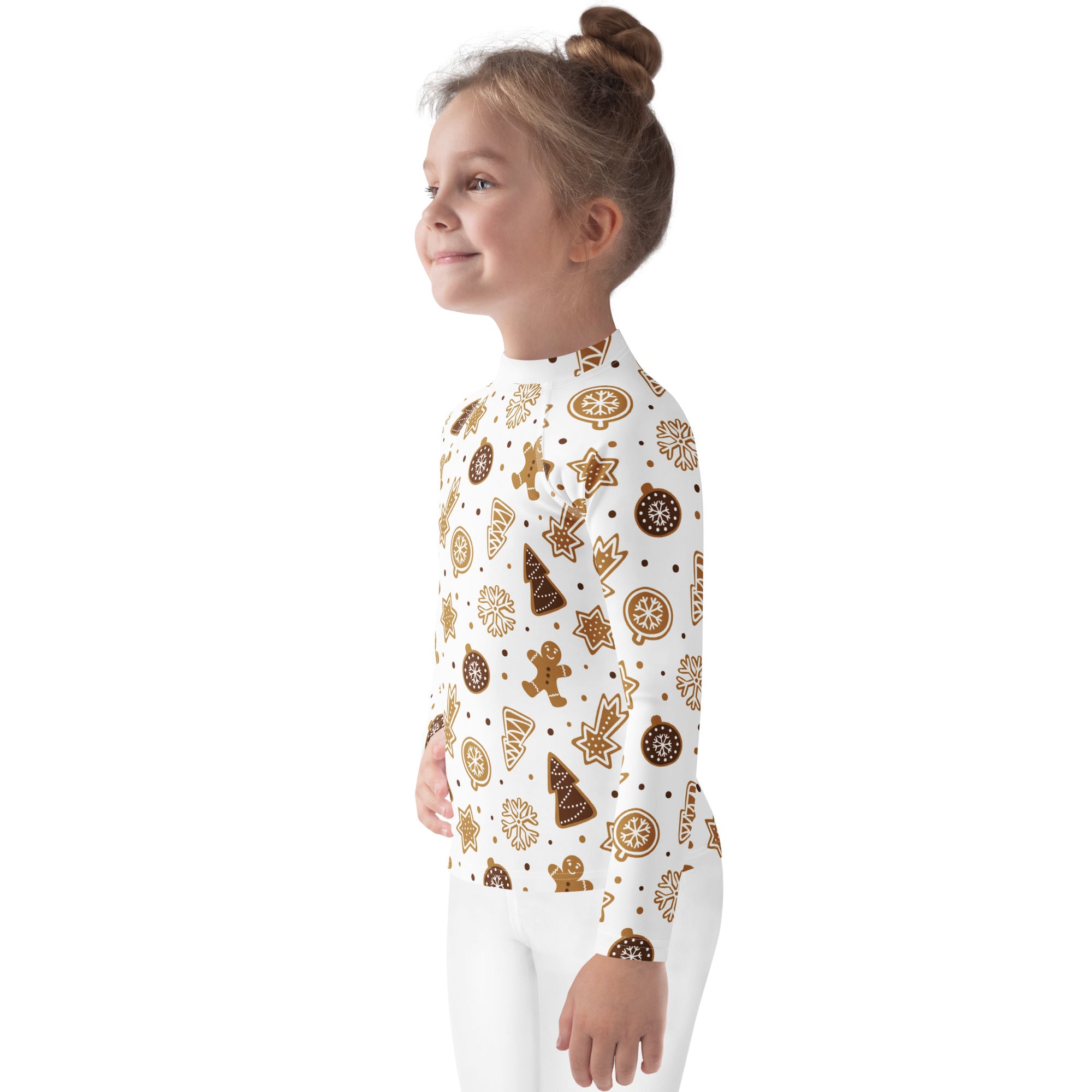 A child wearing a white kids gingerbread cookies christmas long sleeve rash guard swim shirt with upf 50+