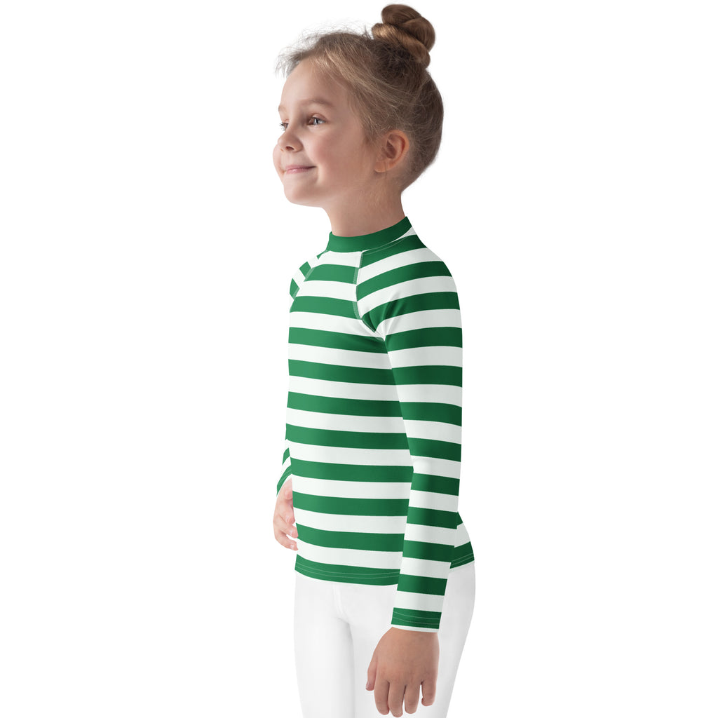 A child wearing a kids green and white striped long sleeve rash guard swim shirt with upf 50 plus protection
