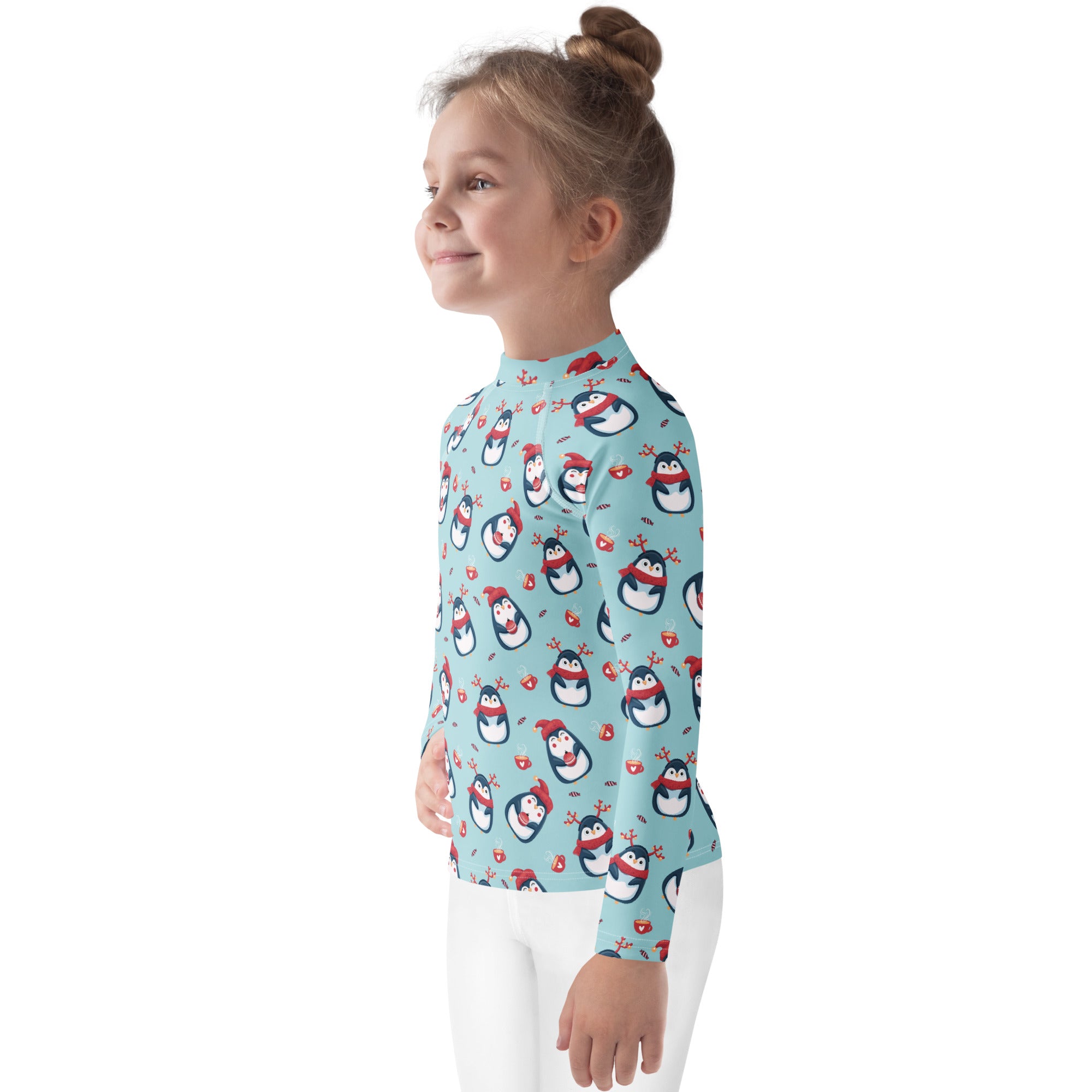 Kids reindeer penguin christmas long sleeve rash guard swim shirt in light blue with cartoon penguins and upf 50+ protection