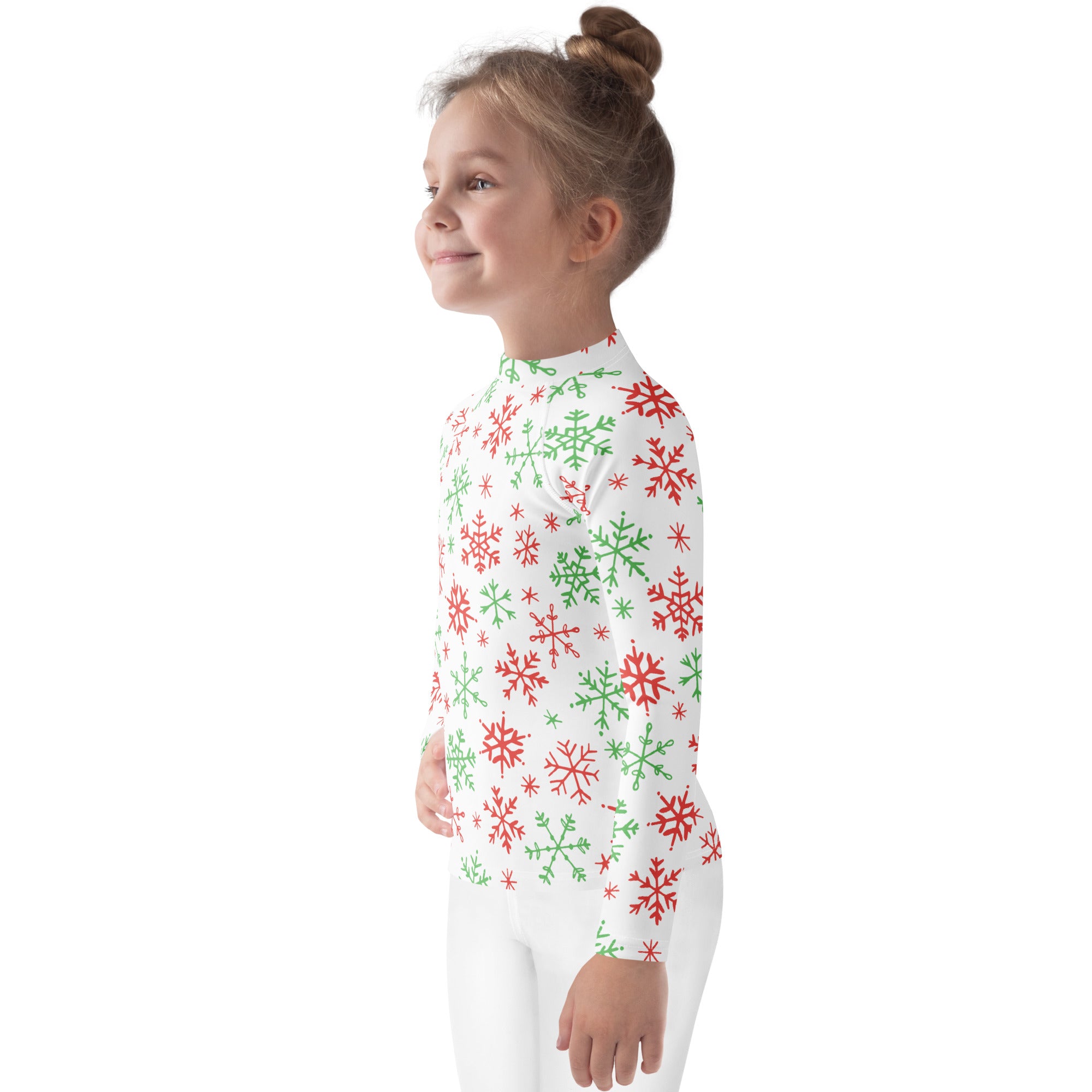 A child wearing a white long-sleeved rash guard swim shirt with red and green snowflake patterns and upf 50+ protection