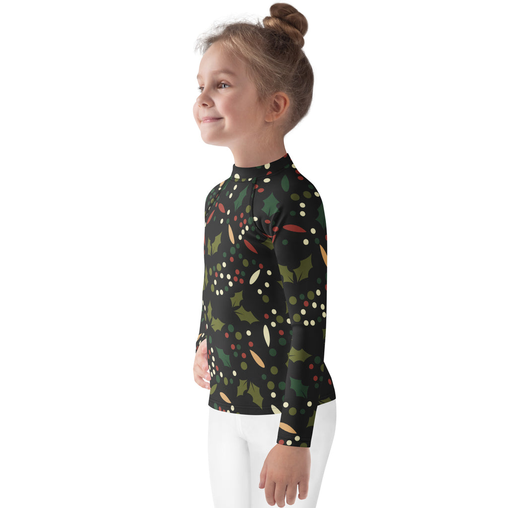 Kids holly christmas long sleeve rash guard swim shirt in black with festive green holly leaves red berries and white dots
