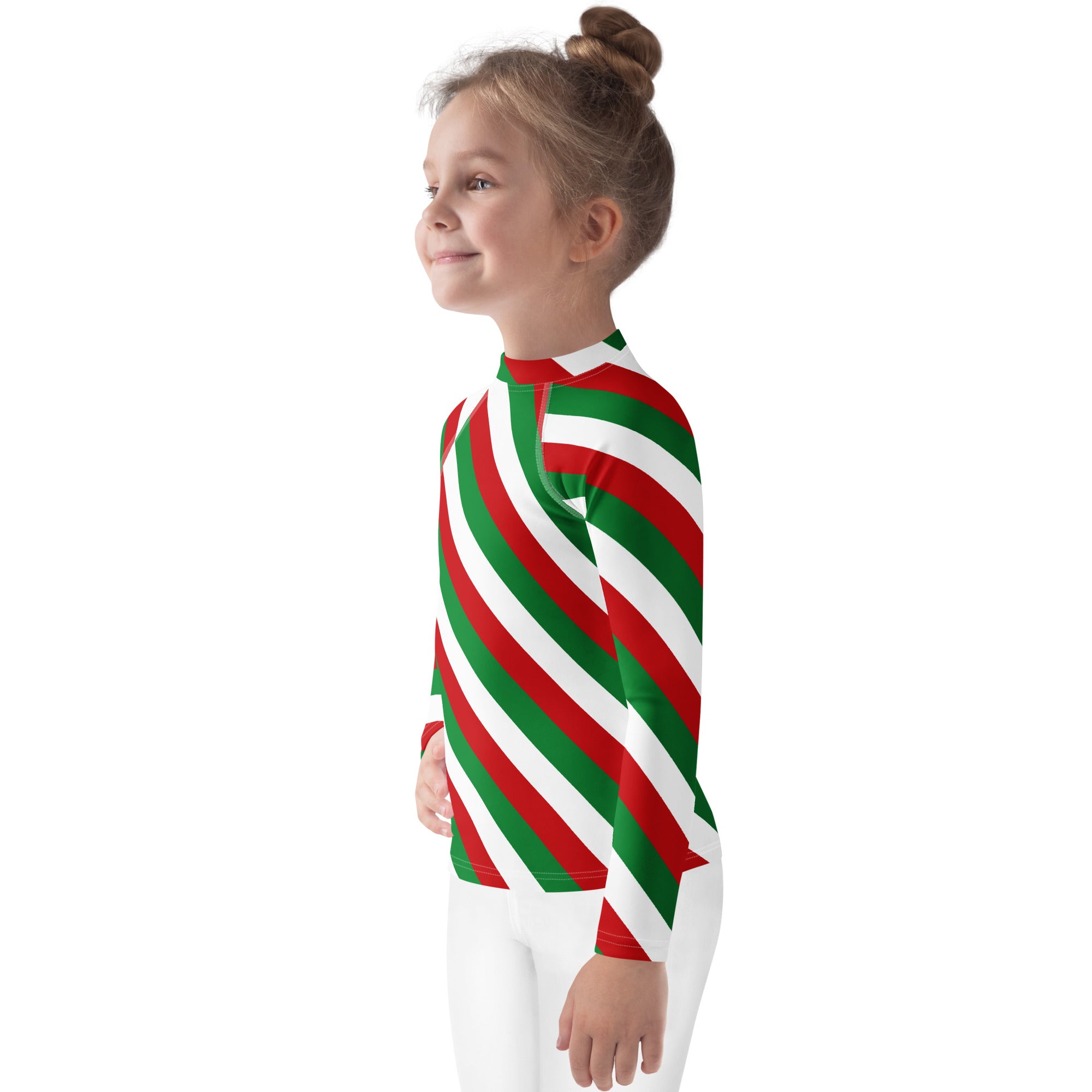 A child wearing a kids bold candy cane stripe christmas long sleeve rash guard swim shirt with upf 50 plus