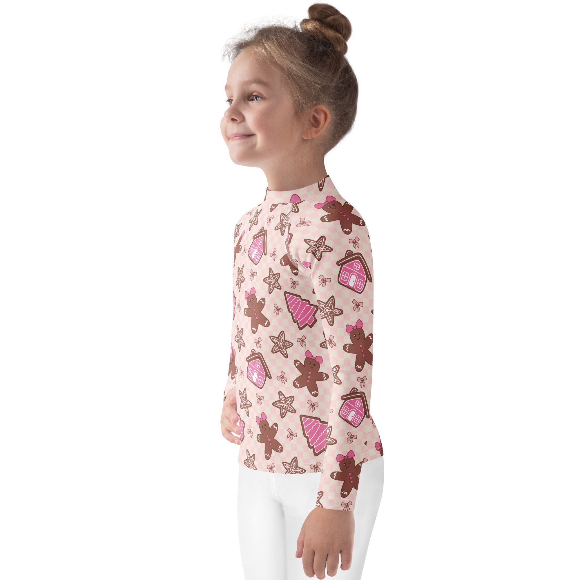 Kids pink long sleeve rash guard swim shirt with upf 50 plus featuring gingerbread men and festive cookie pattern