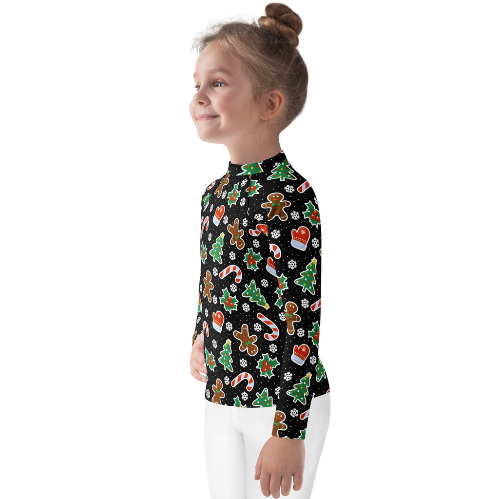 Kids black long sleeve rash guard swim shirt with Christmas cookie and candy cane patterns and UPF 50 plus protection
