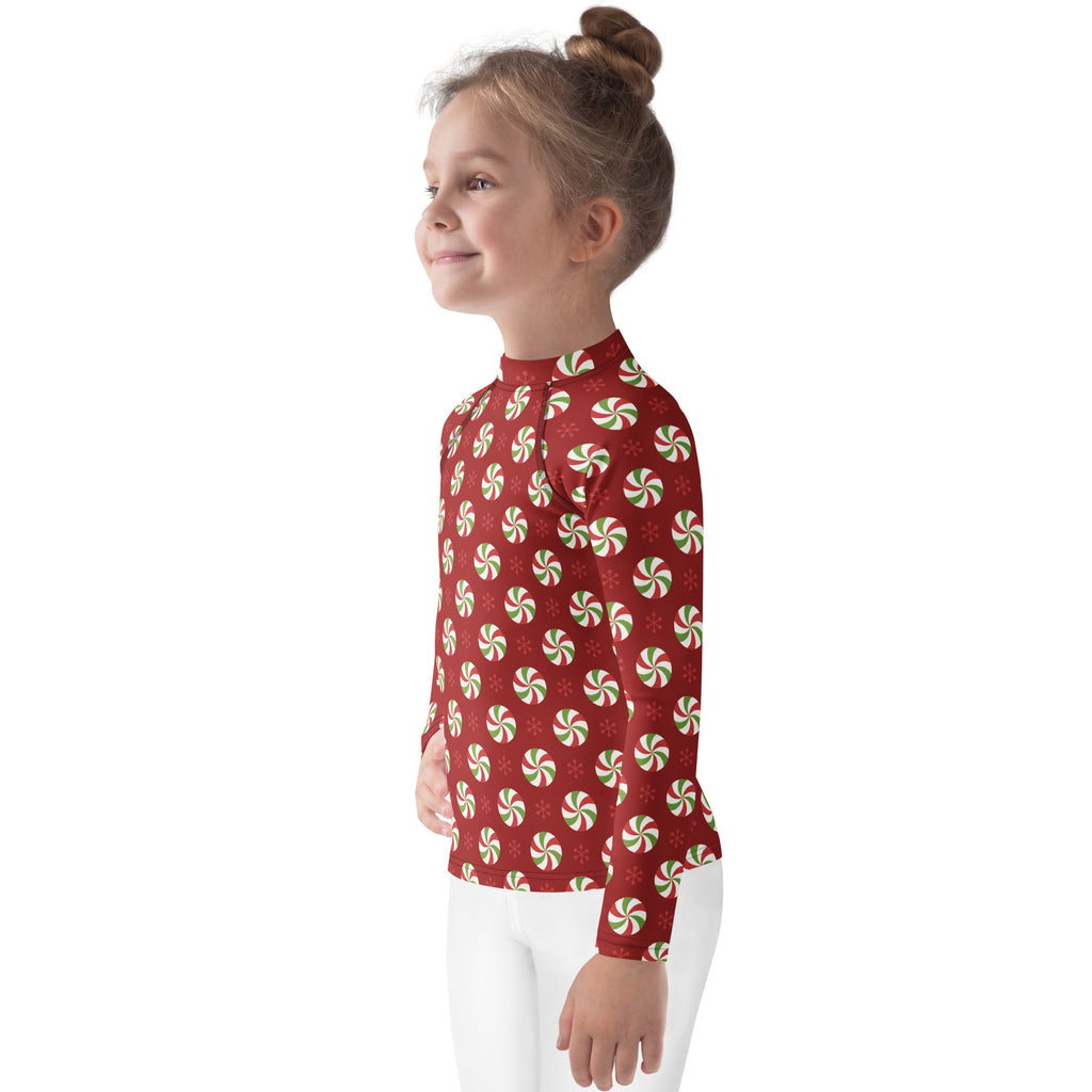 Red kids long sleeve rash guard swim shirt with green and white peppermint pattern and UPF 50 plus for christmas use
