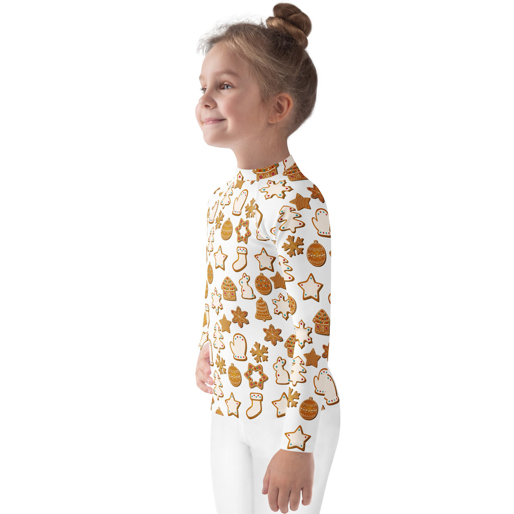 A child wearing a white kids christmas gingerbread cookie long sleeve rash guard swim shirt with upf 50+