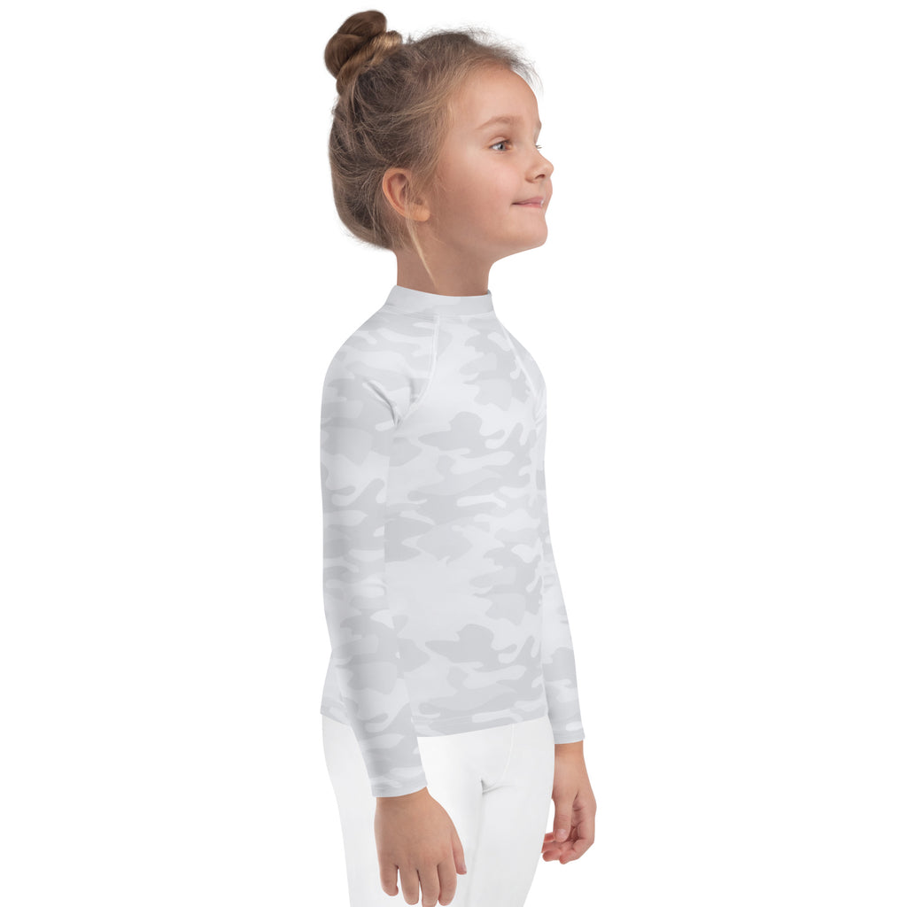 A child wearing a kids white camouflage long sleeve rash guard swim shirt with UPF 50 plus protection