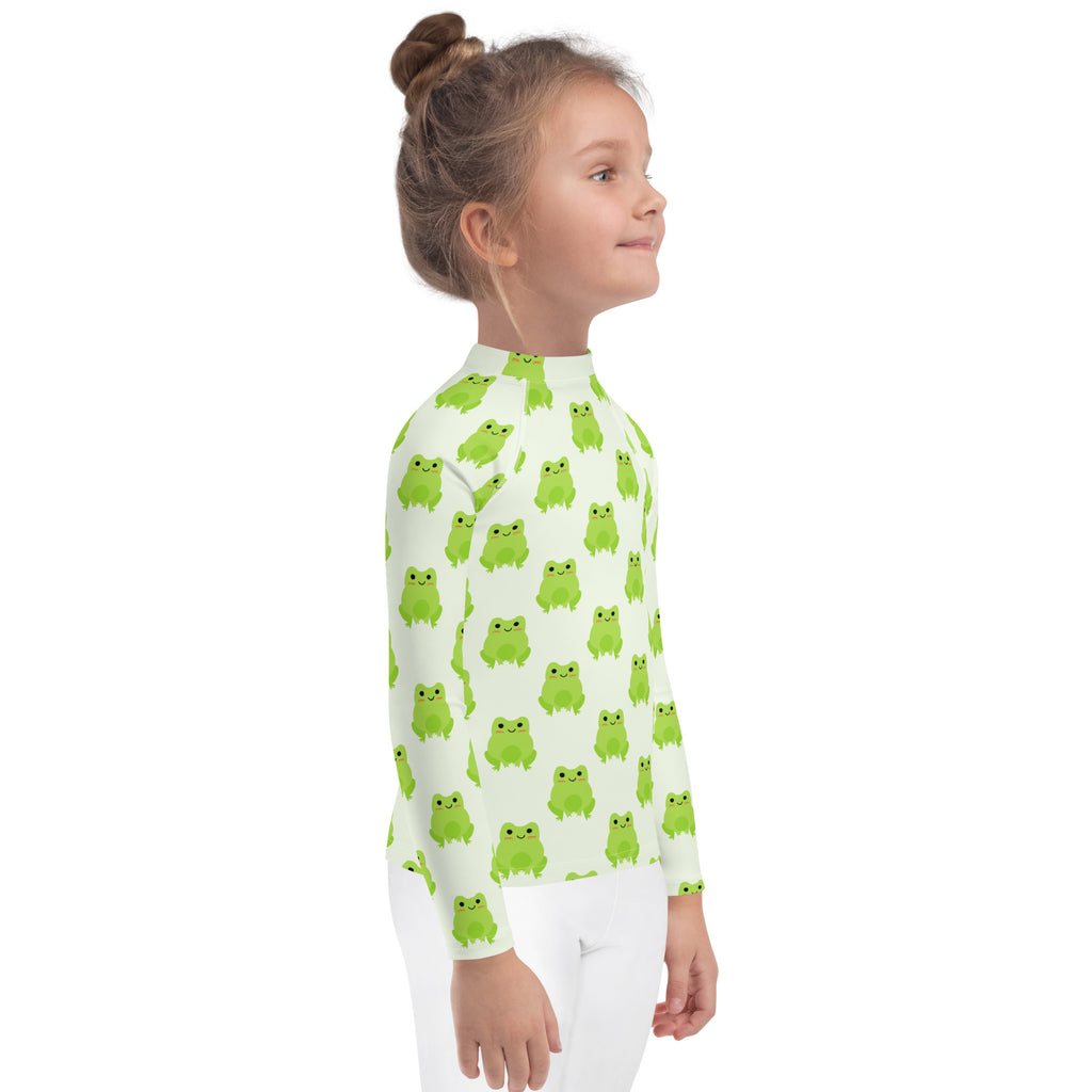 Kids green frog long sleeve rash guard swim shirt with upf 50 plus featuring light green frog pattern on pale fabric