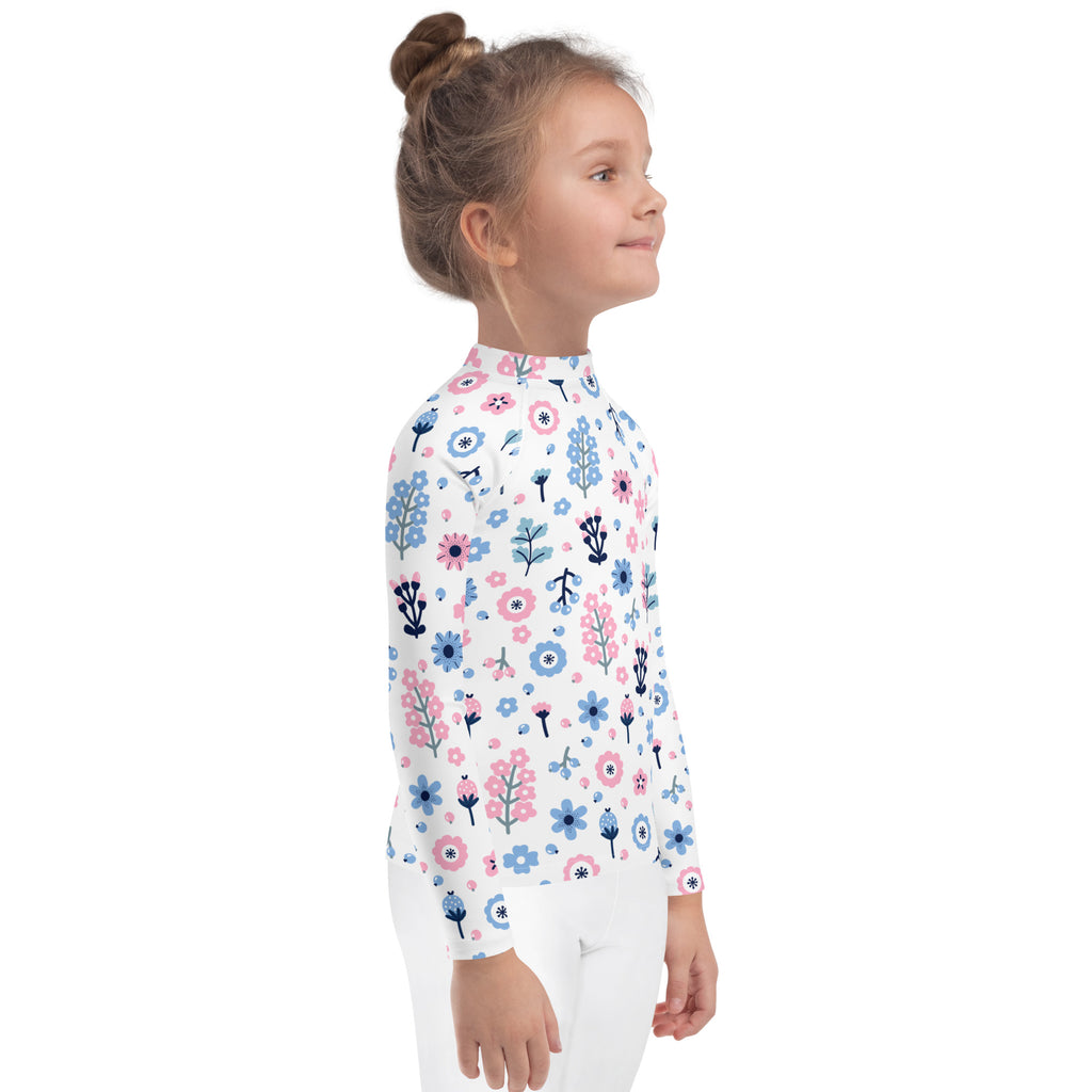 White girls long sleeve rash guard swim shirt with pink and blue floral pattern and UPF 50 plus protection