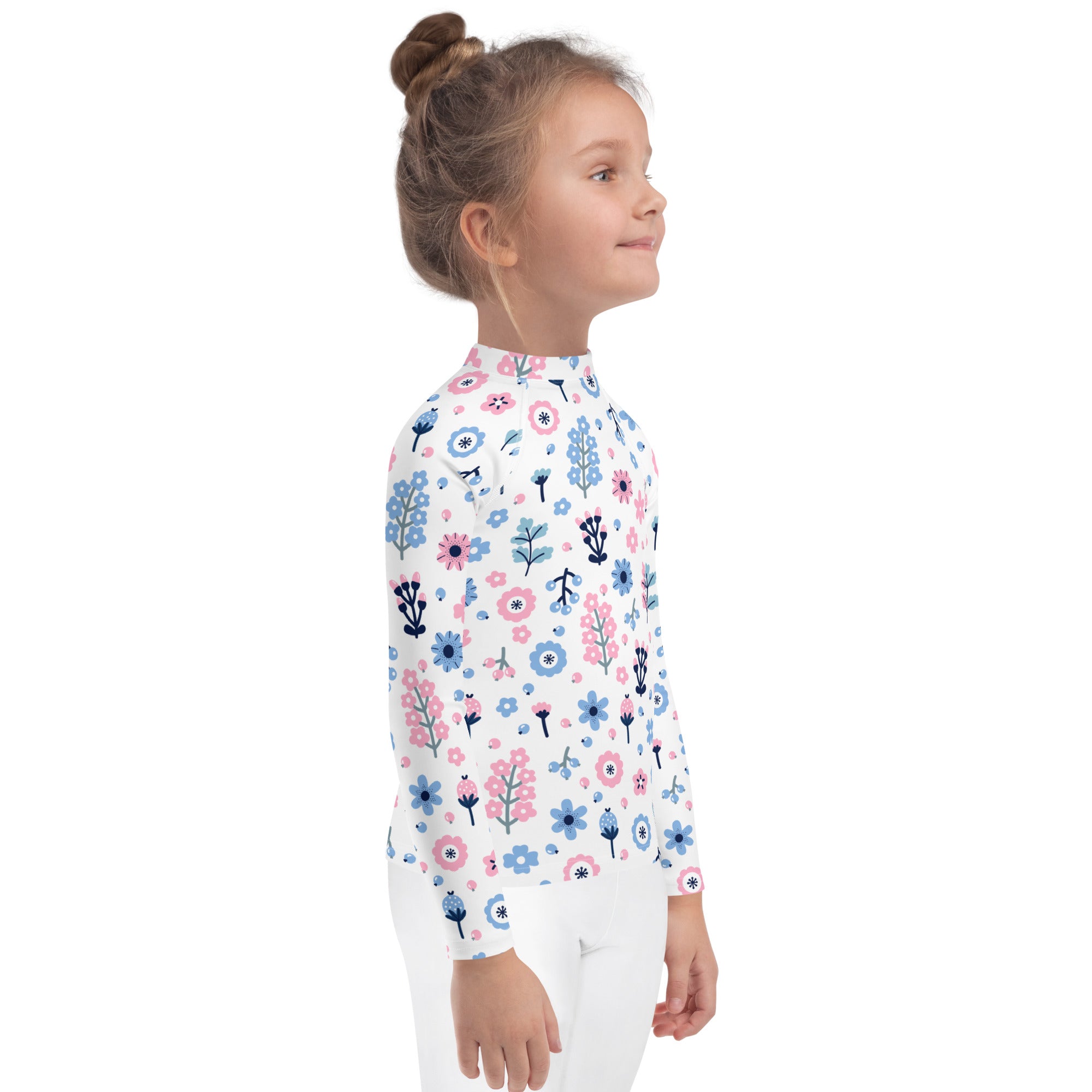 White girls long sleeve rash guard swim shirt with pink and blue floral pattern and UPF 50 plus protection
