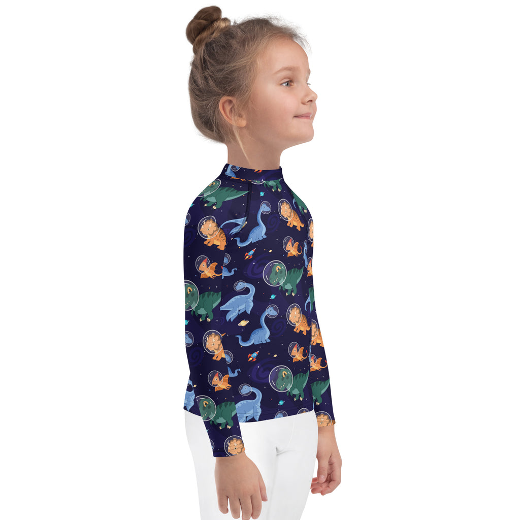 Kids navy blue long sleeve rash guard swim shirt with cartoon dinosaurs in space pattern and UPF 50 plus protection