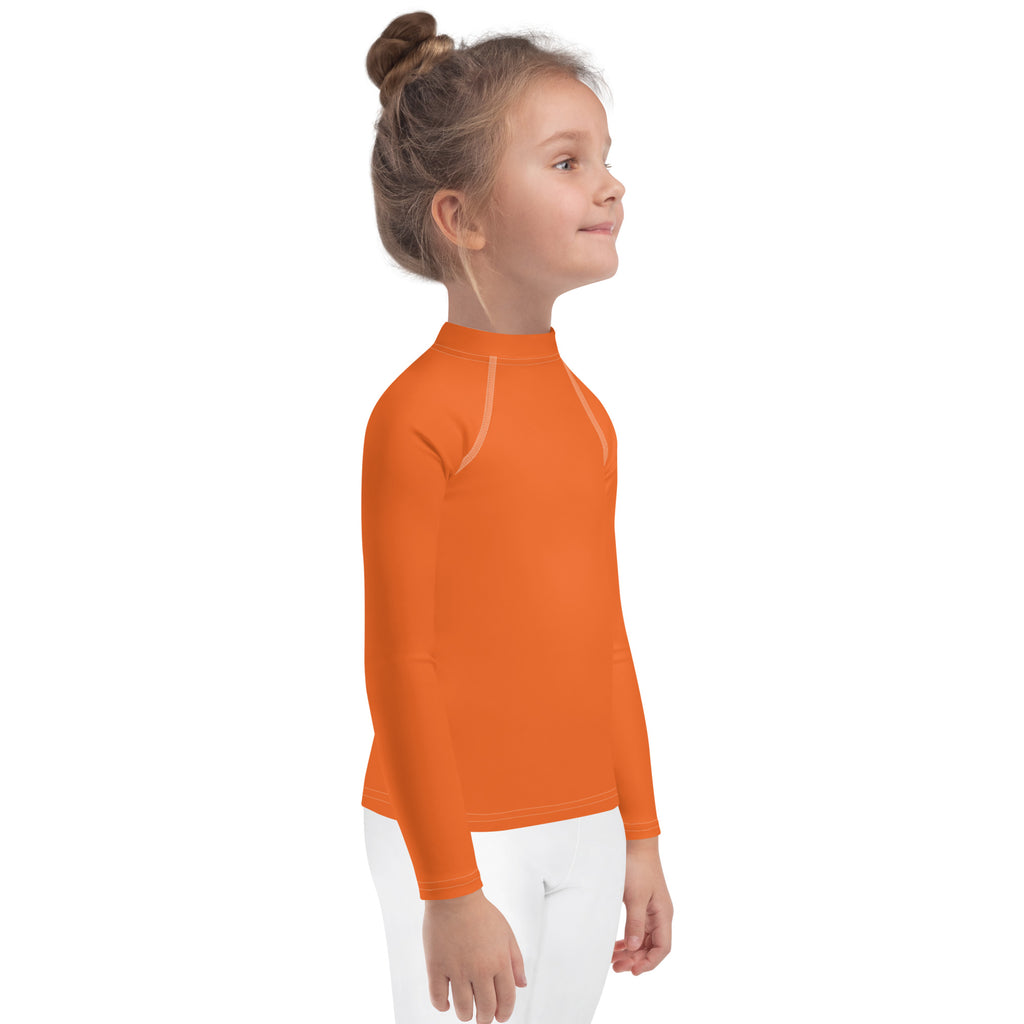Kids orange long sleeve rash guard swim shirt with UPF 50 plus featuring a high collar and white seam detailing
