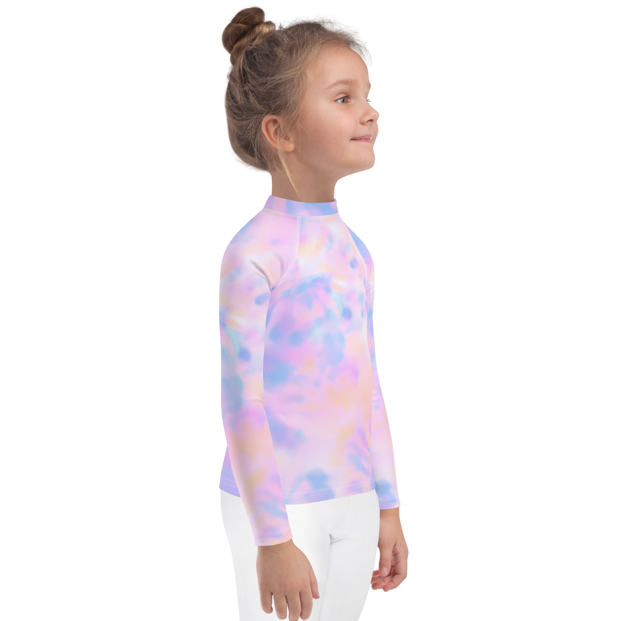 A child wearing a girls pastel watercolor long sleeve rash guard swim shirt with upf 50 plus in pink purple and blue