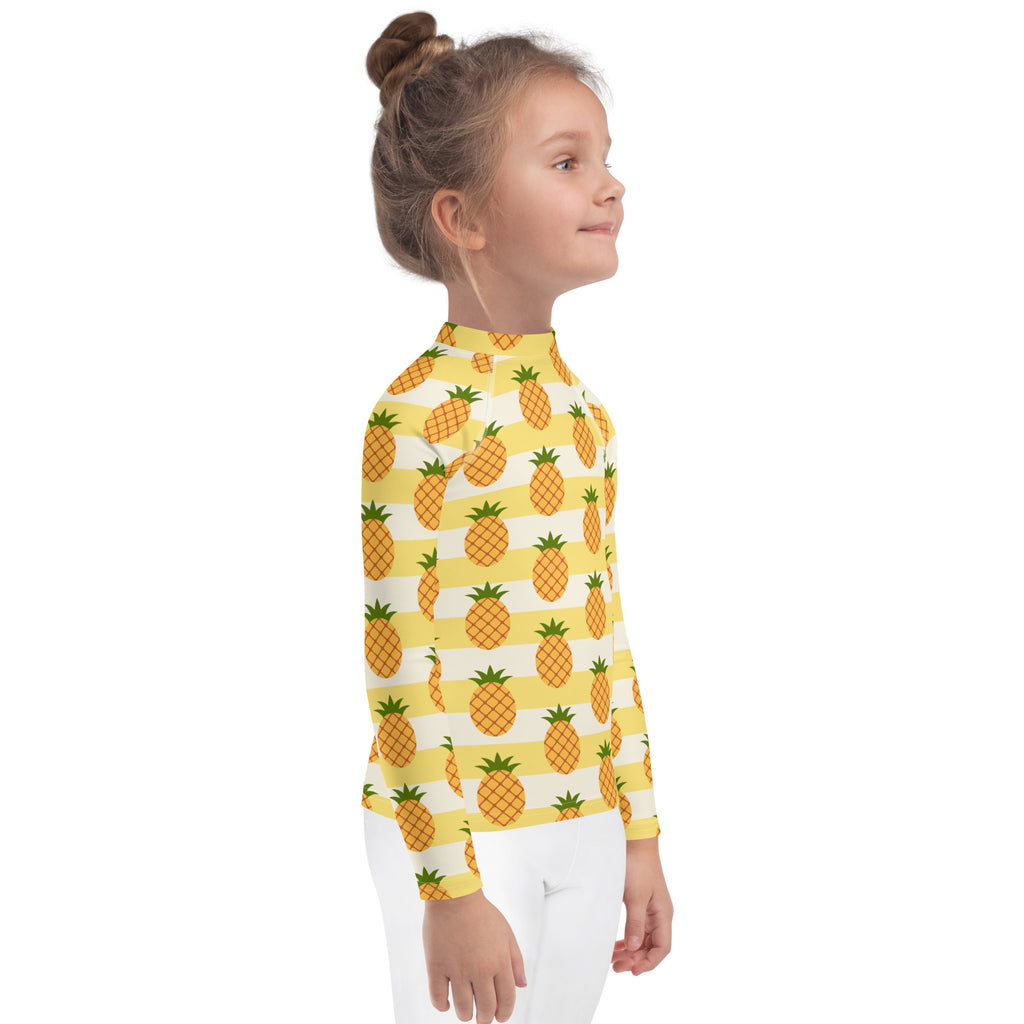 Kids pineapple striped long sleeve rash guard swim shirt in yellow and white with pineapple pattern and upf 50 plus protection